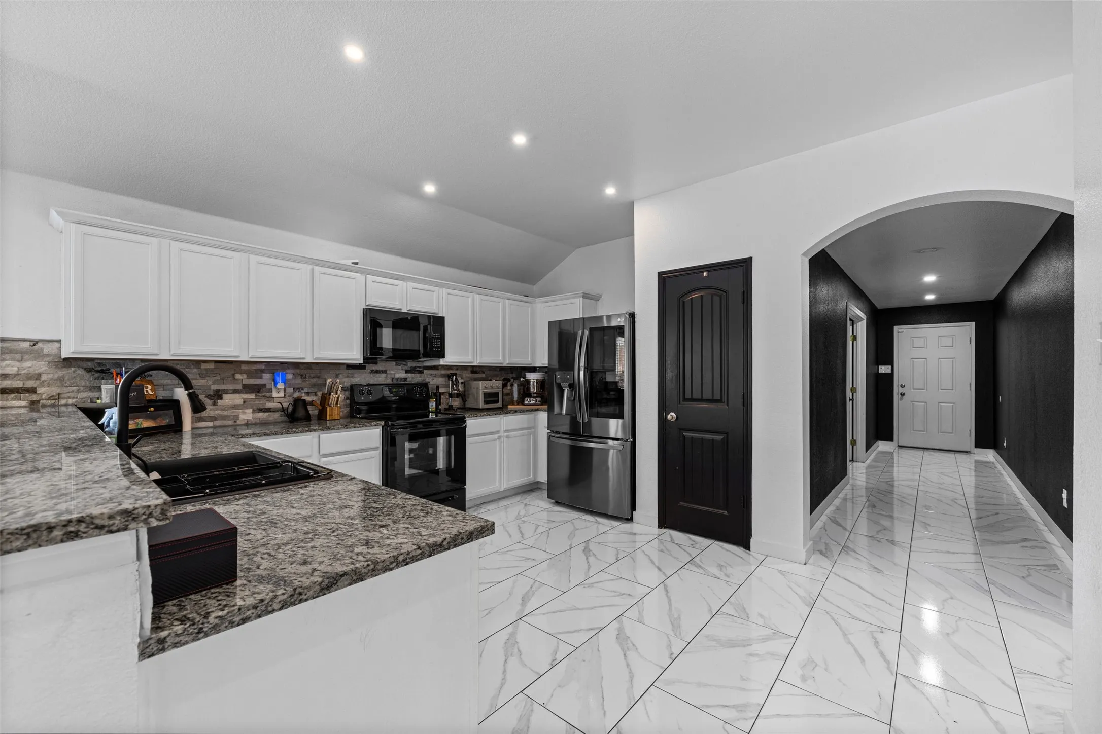 Featuring the large kitchen and foyer view