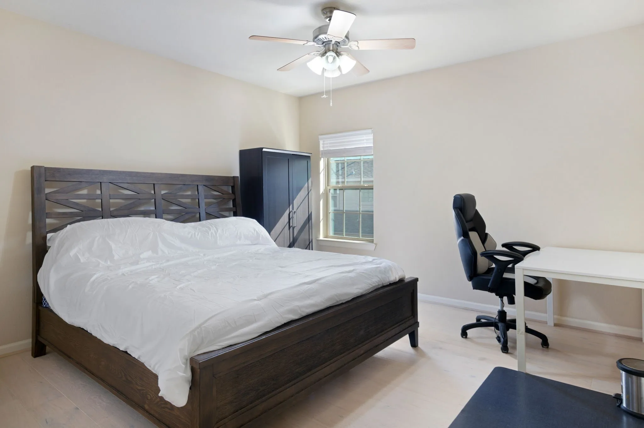 Neutral tone wall paint with a ceiling fan