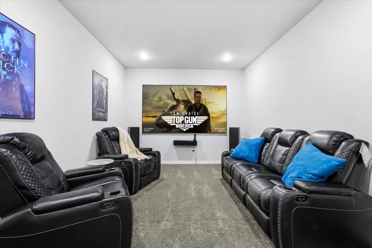Spacious Media room featuring surround sound, and a projector.