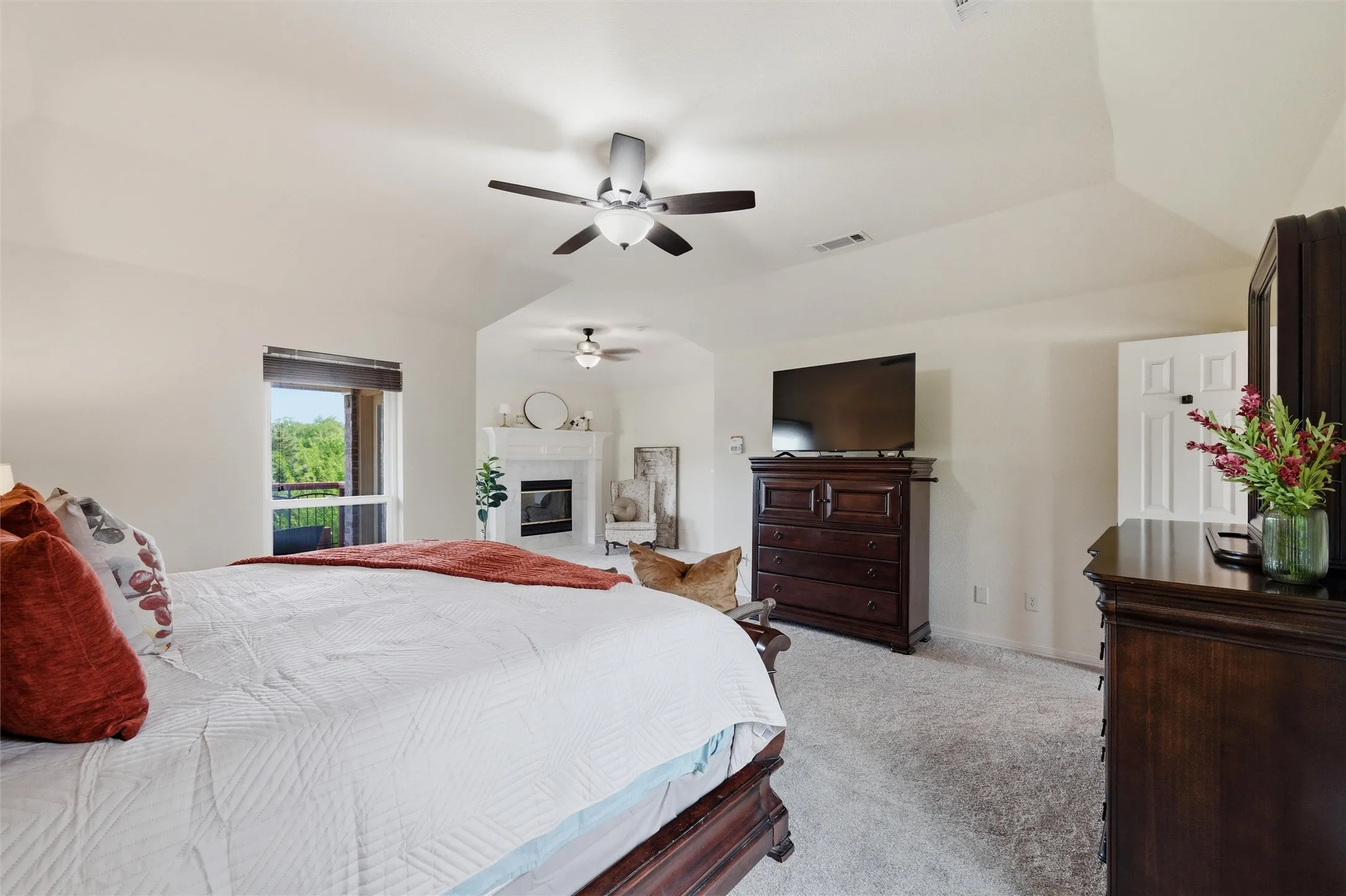 Primary Bedroom with fireplace.