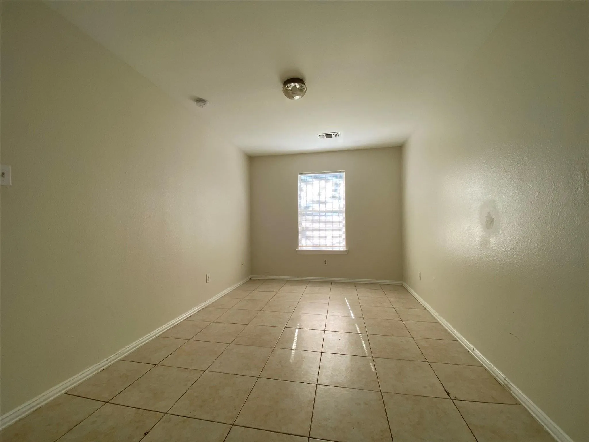 View of tiled spare room