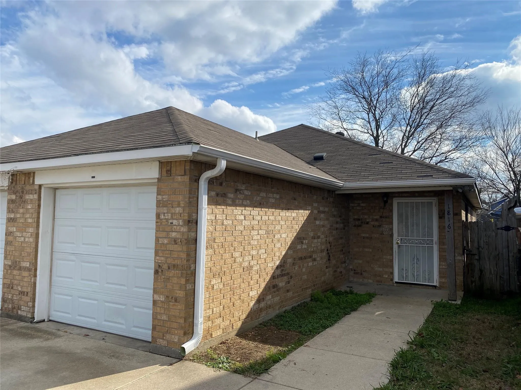 View of side of property featuring a garage