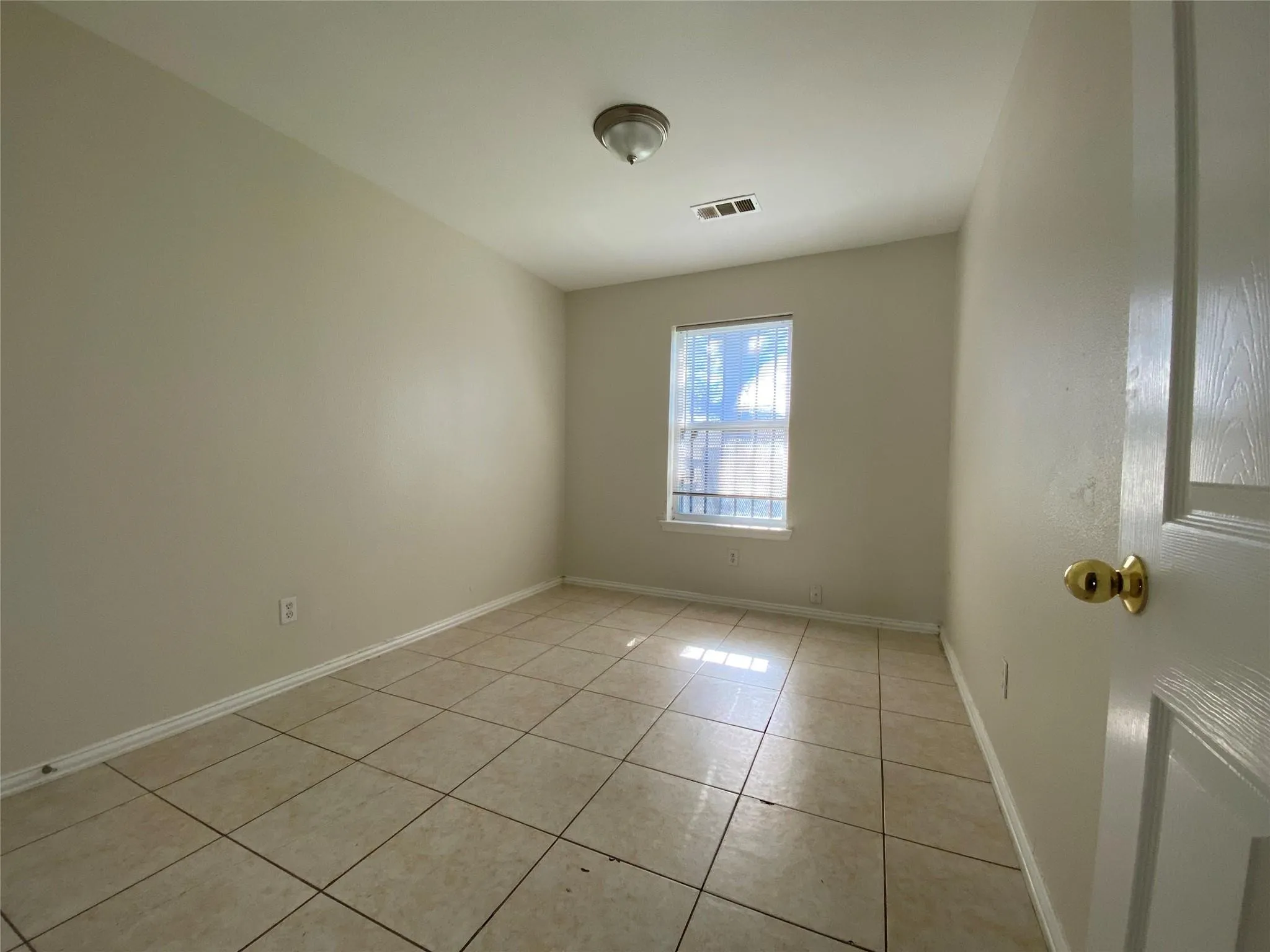 View of tiled empty room
