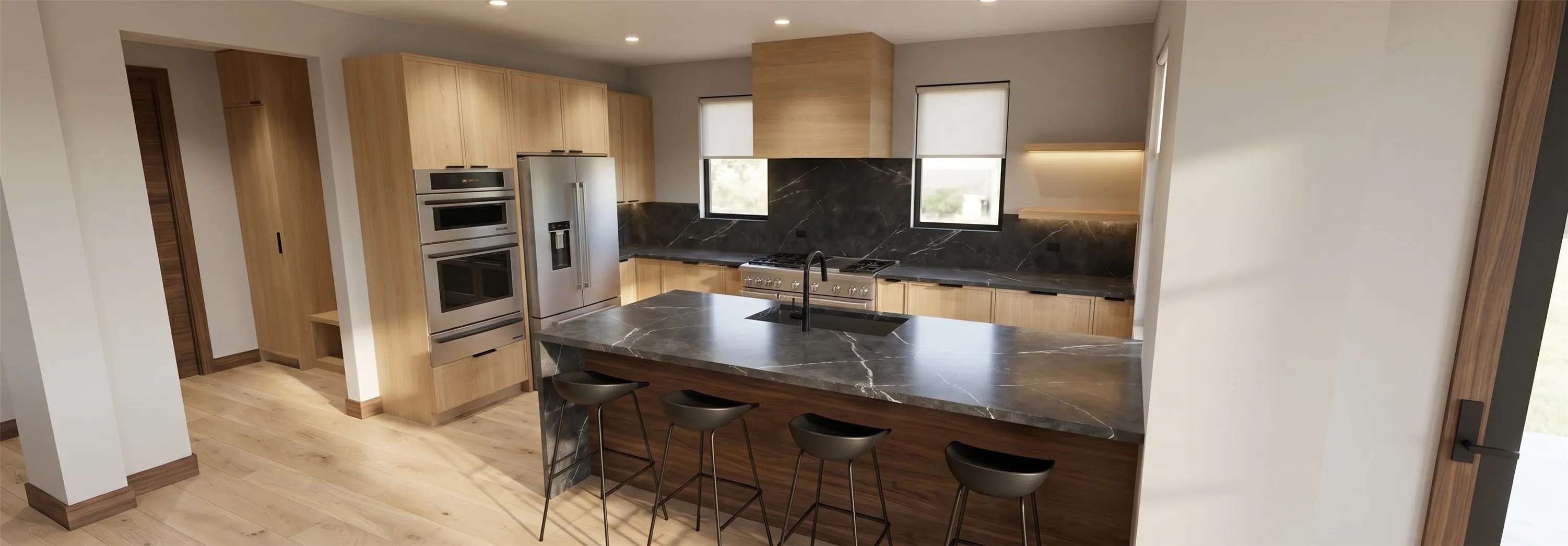 Modern kitchen featuring a large central island with seating, a dark countertop with distinctive veining, and an integrated sink