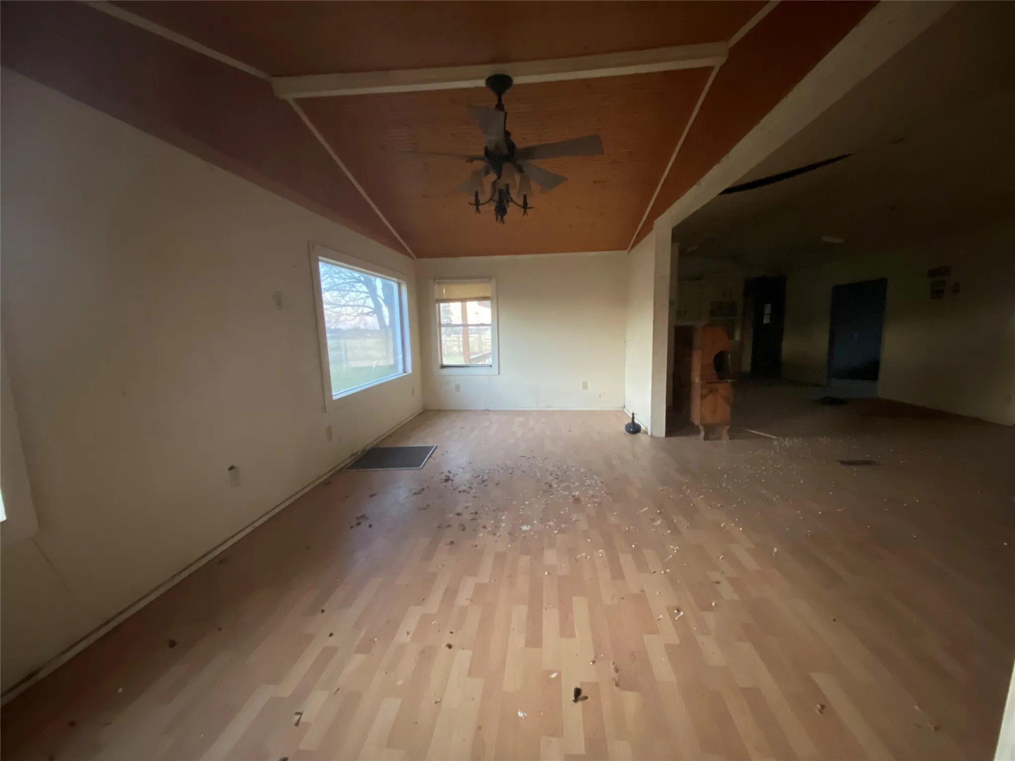 Spare room featuring ceiling fan and lofted ceiling