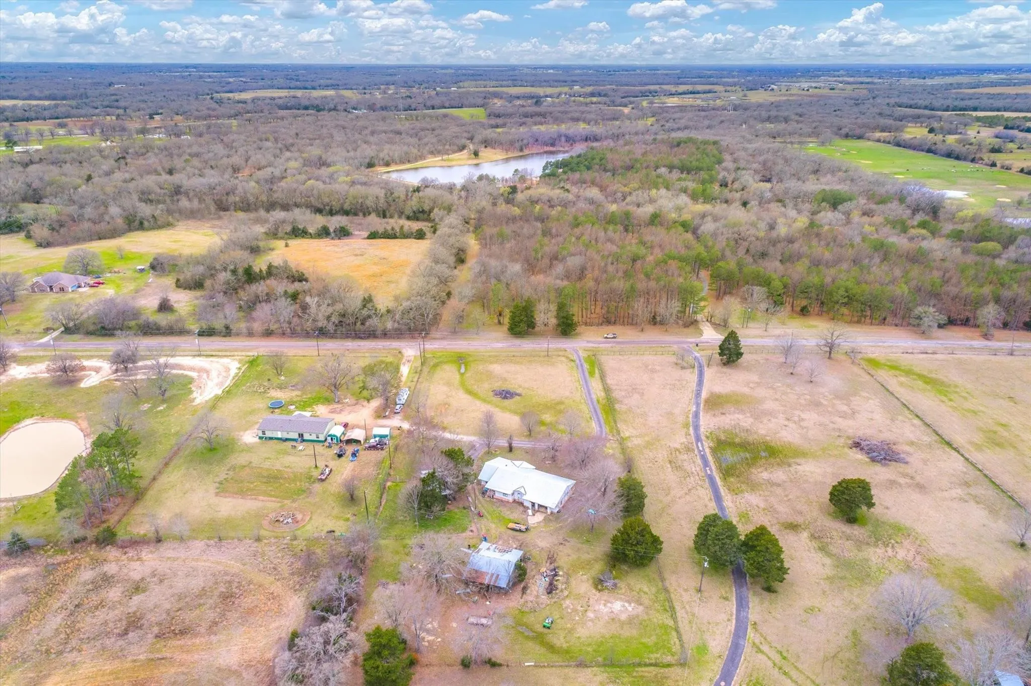 Birds eye view of property featuring a rural view and a water view