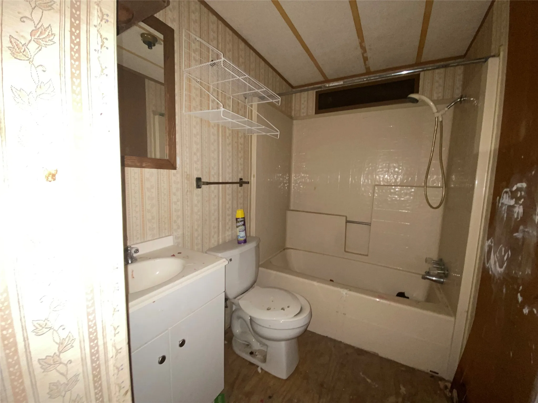 Full bathroom featuring vanity, shower / bathtub combination, and toilet
