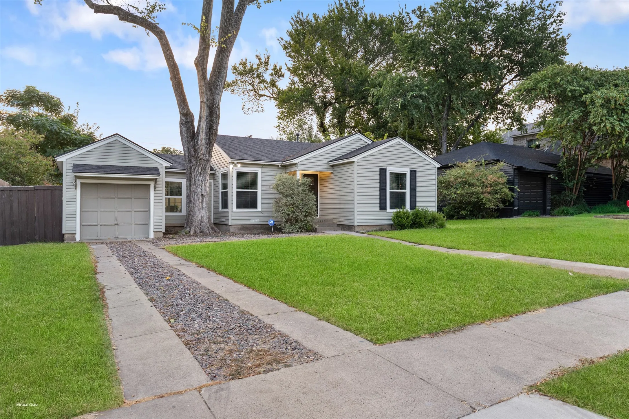 Light gray siding exterior with dark gray shingle roof