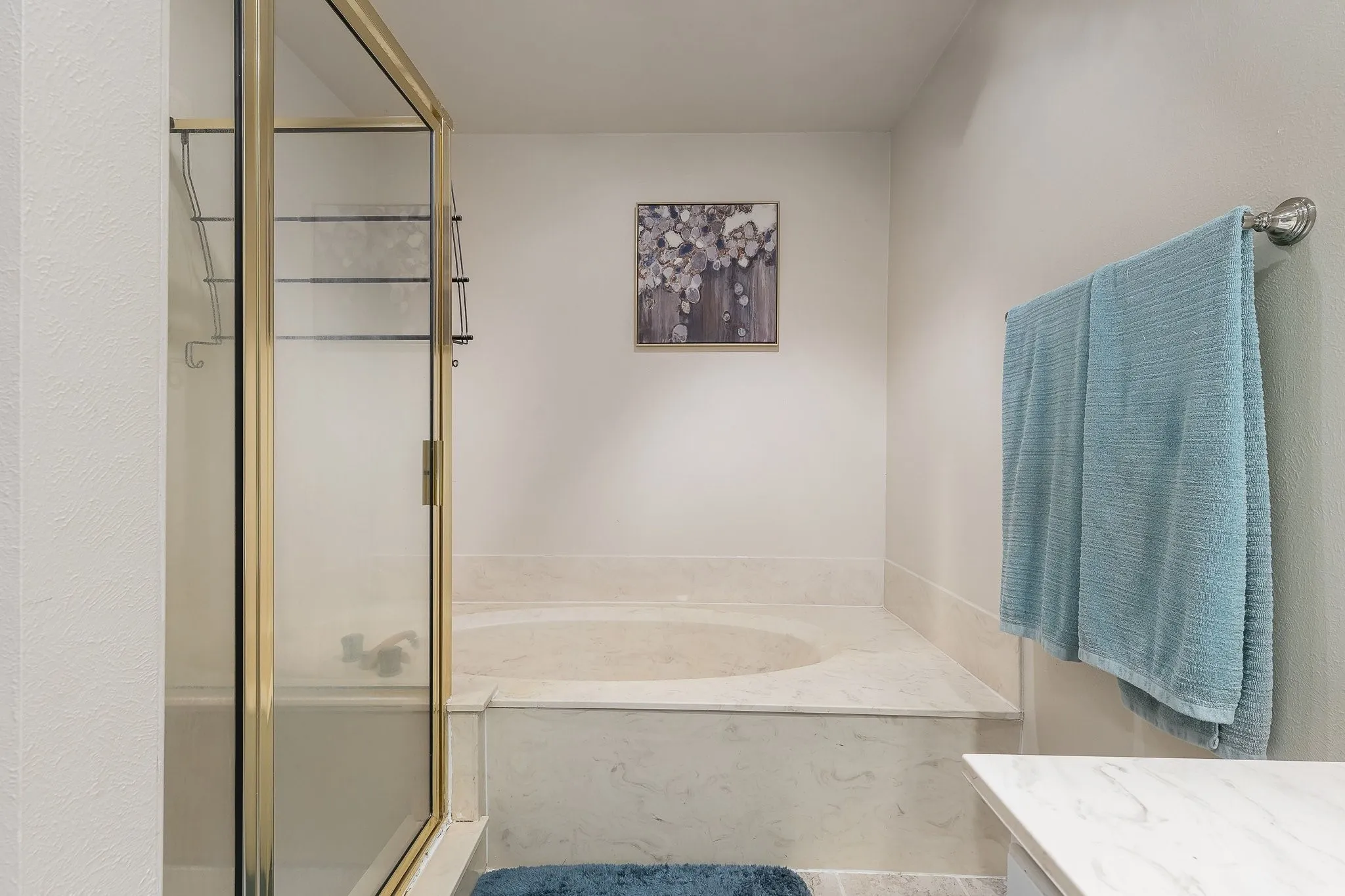 Primary bath with soaking tub and separate shower.