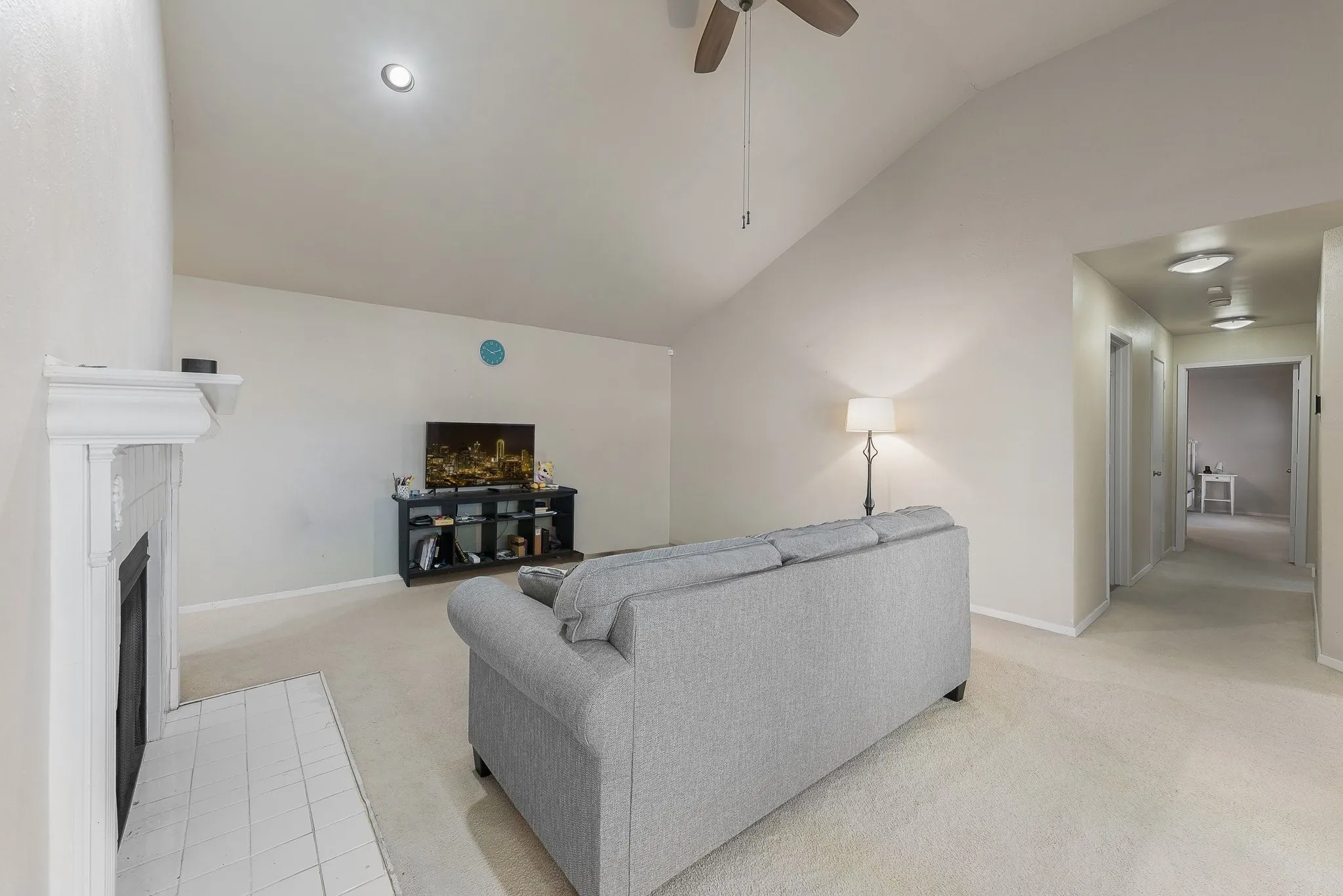 Spacious living room, vaulted ceilings, fireplace.