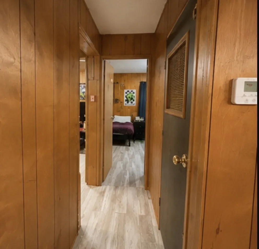 Wood-paneled walls with light-toned flooring