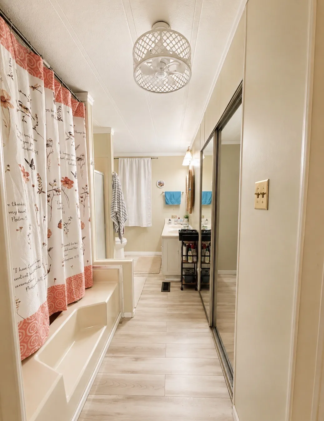 Tub and shower combination, wood-finish flooring, mirrored sliding closet doors, and recessed lighting
