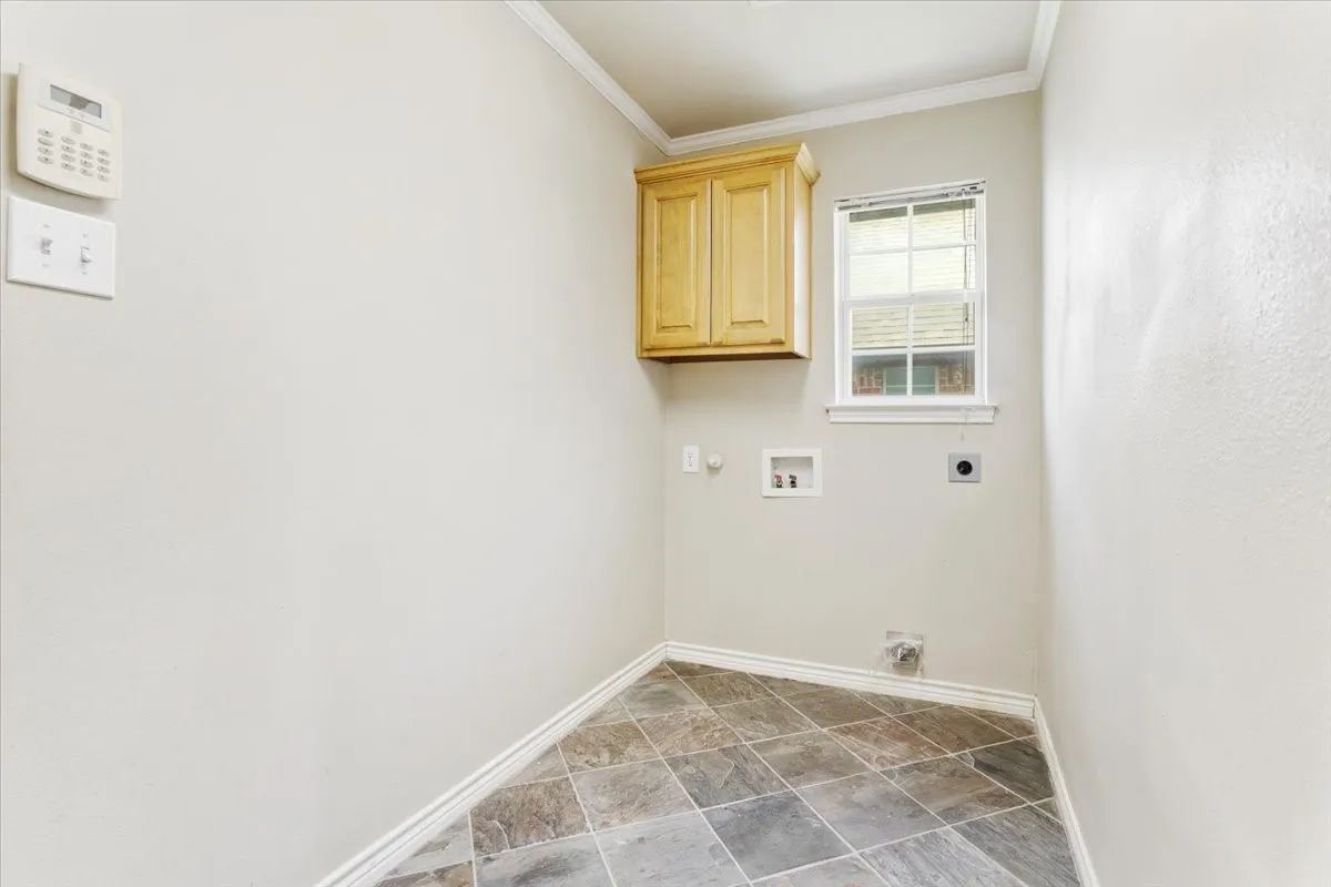 Laundry room between breakfast room and garage. Also has large pantry
