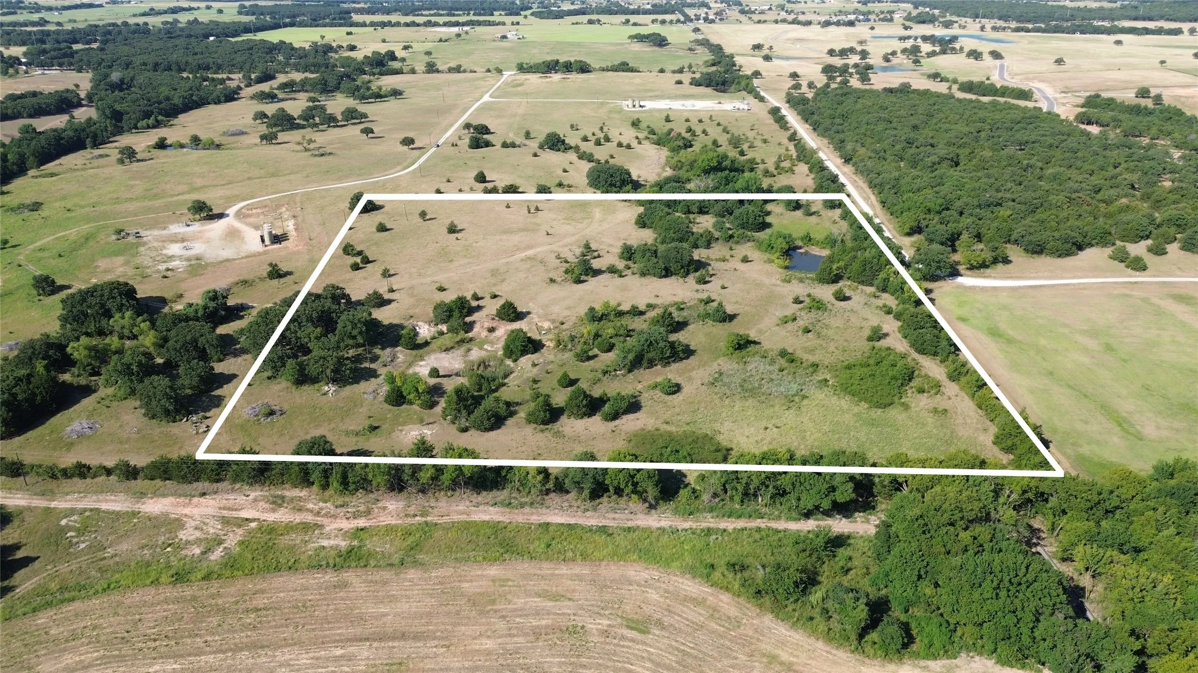 Back fenceline looking toward Well Service Rd.