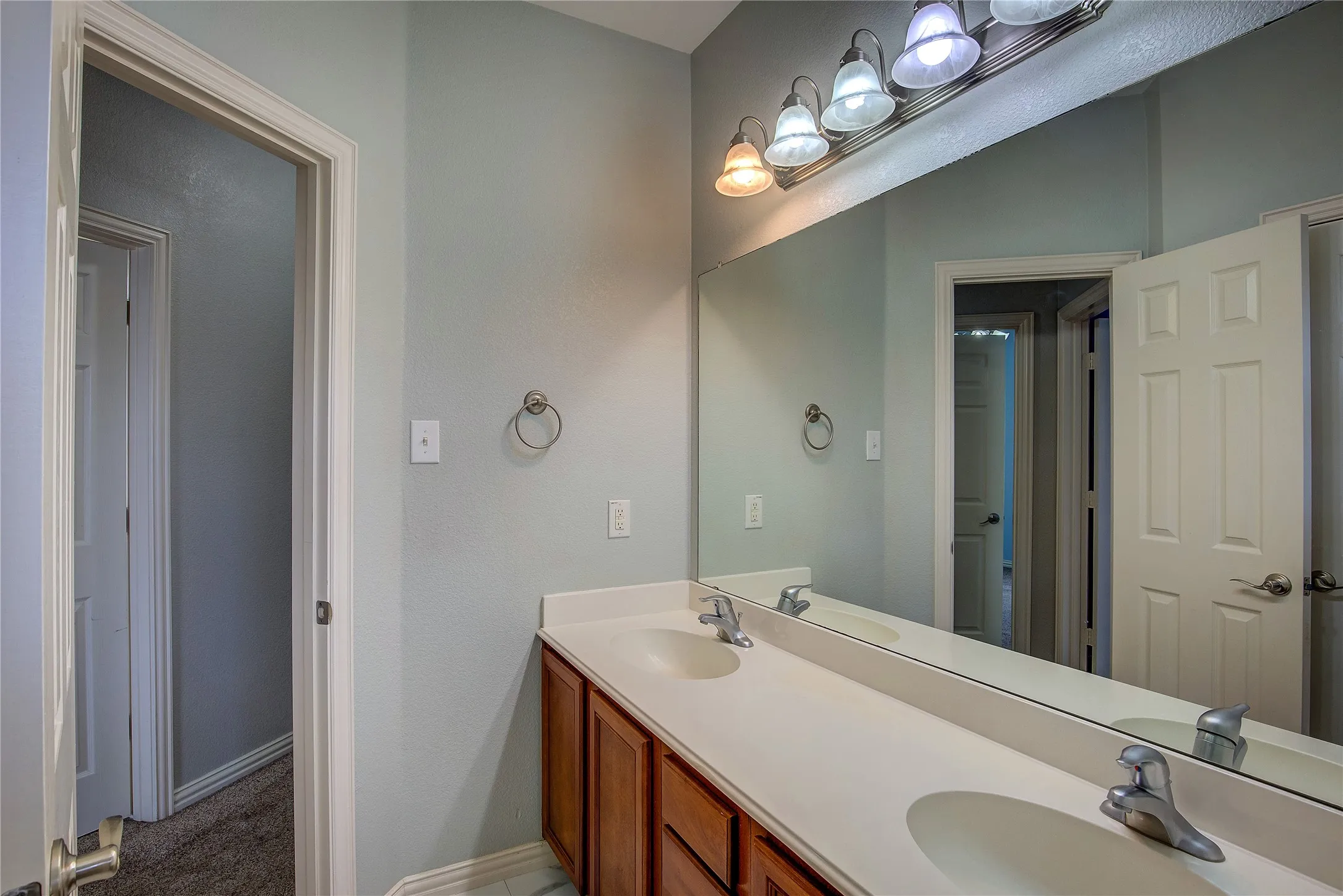 Bathroom featuring dual vanity