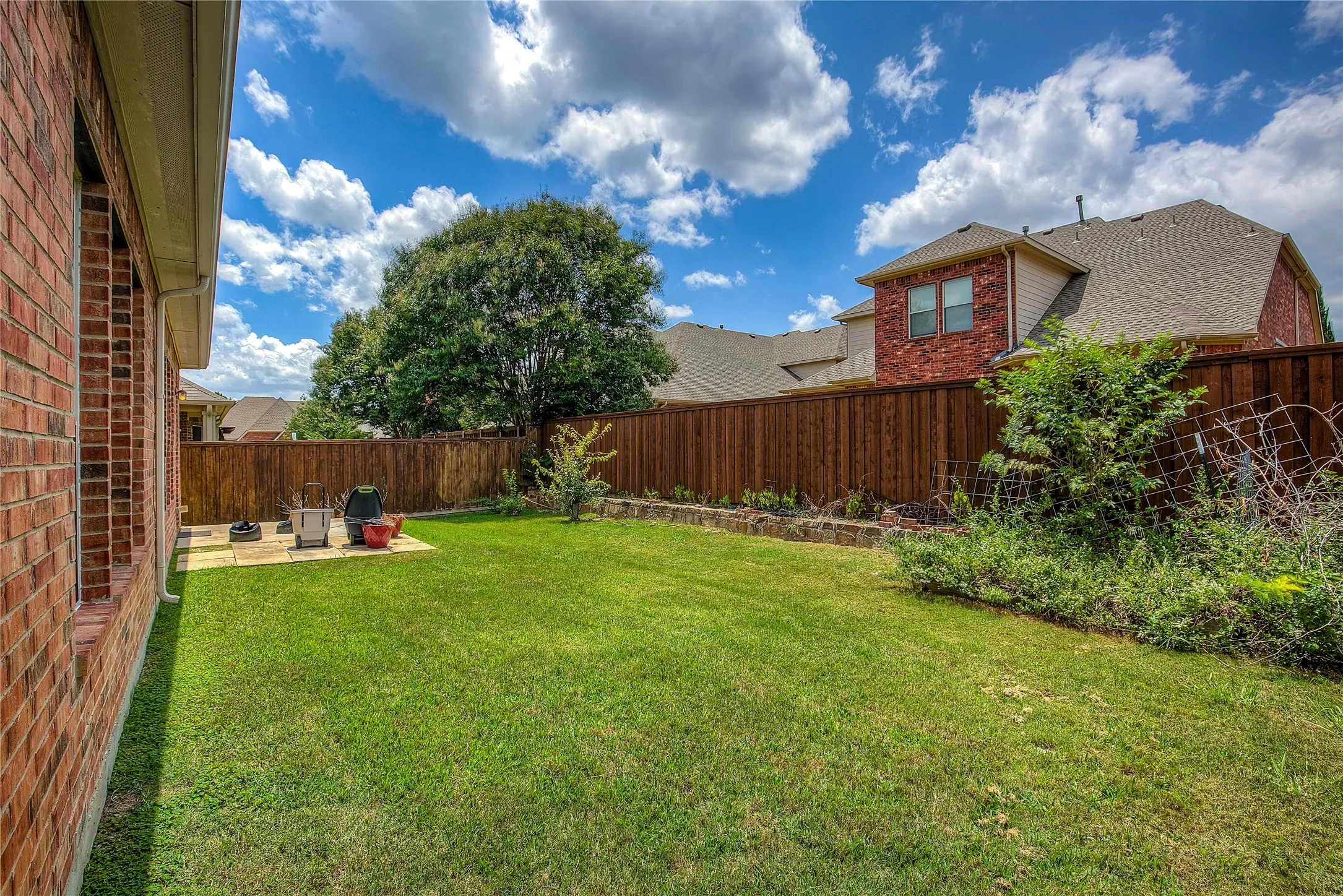 View of yard with a patio