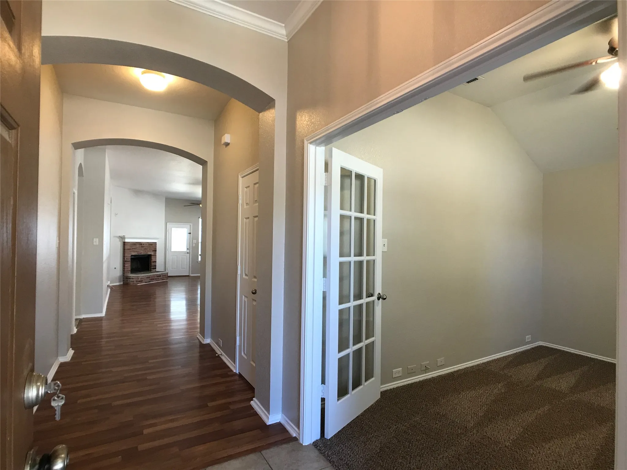 Entryway featuring wood-finish flooring extending into the main living space