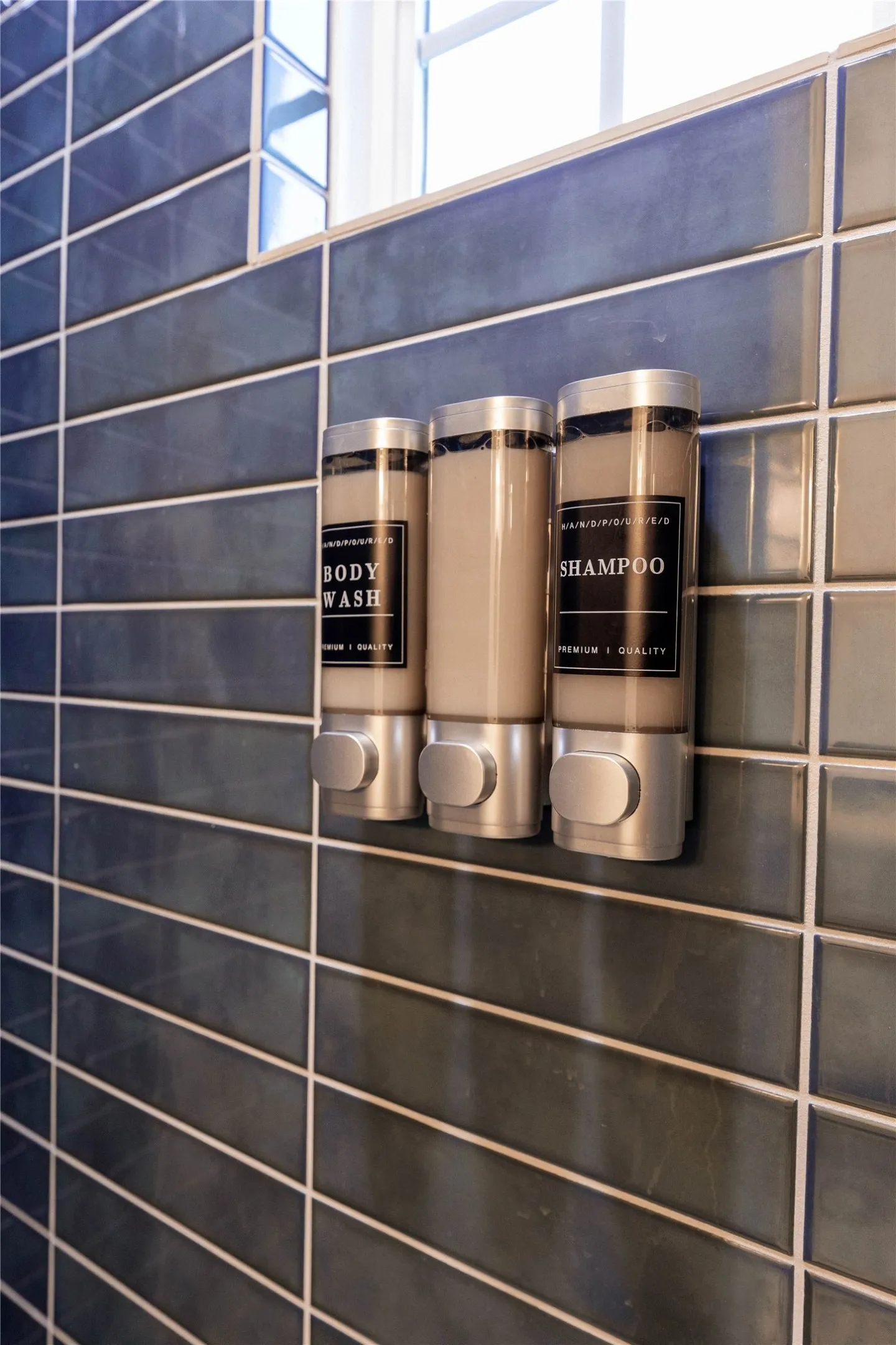 Dark blue subway tile with light grout lines