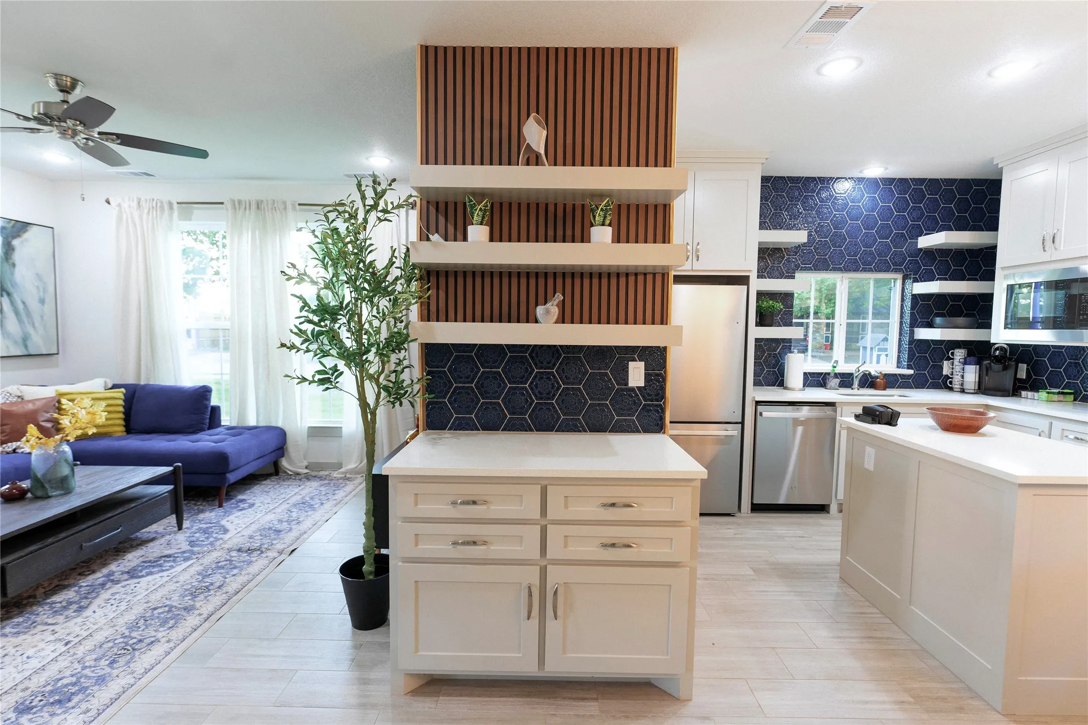 Open-concept living space featuring wood-finish flooring