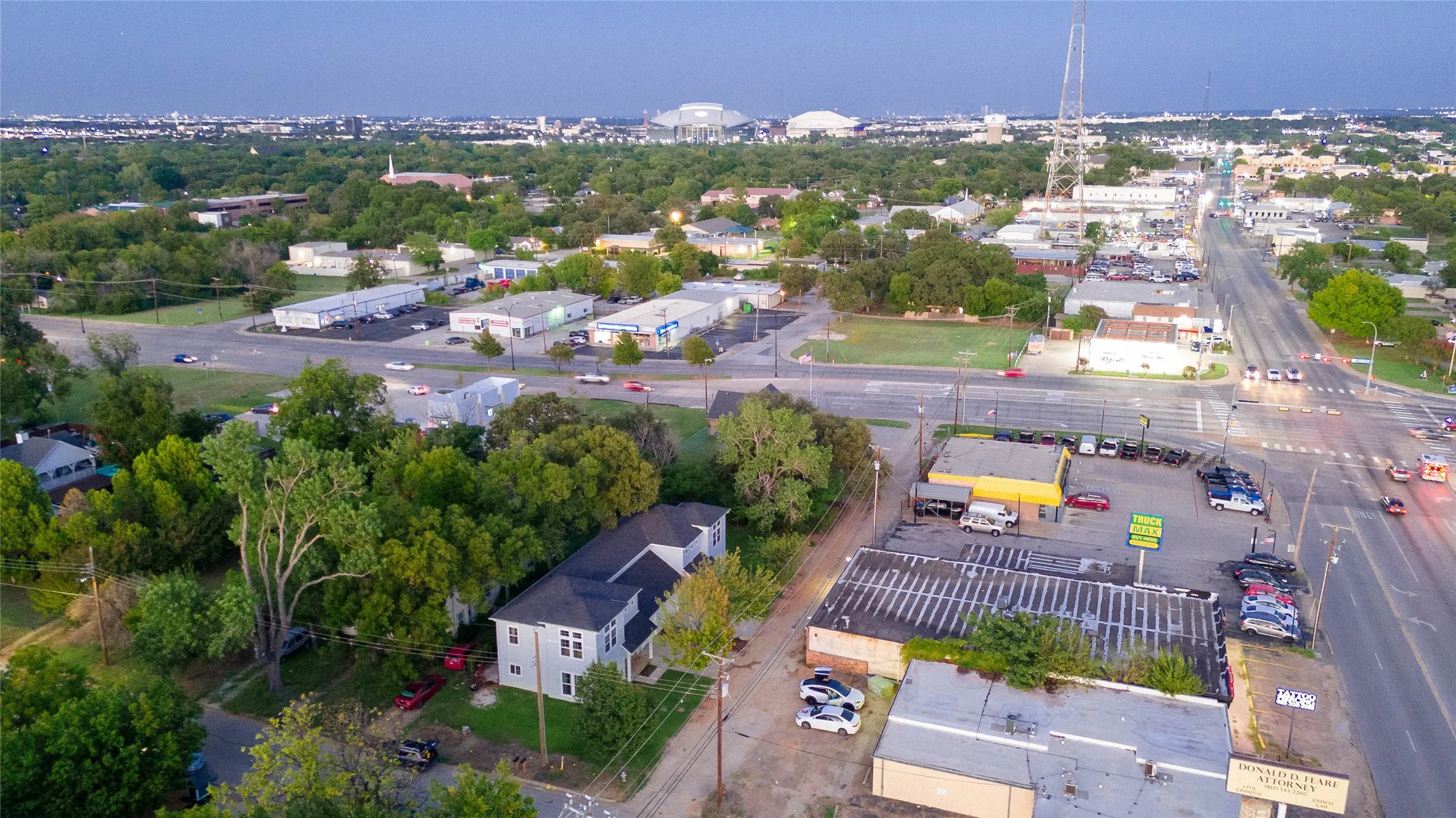 Aerial view showcasing the property's strategic location within an established commercial and residential corridor