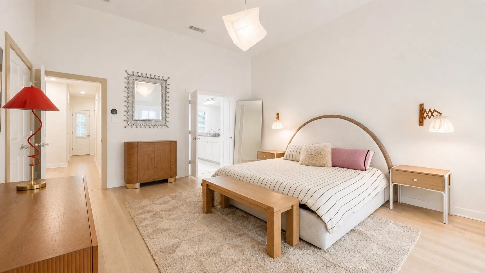 Vaulted ceilings complement the light wood-finish flooring