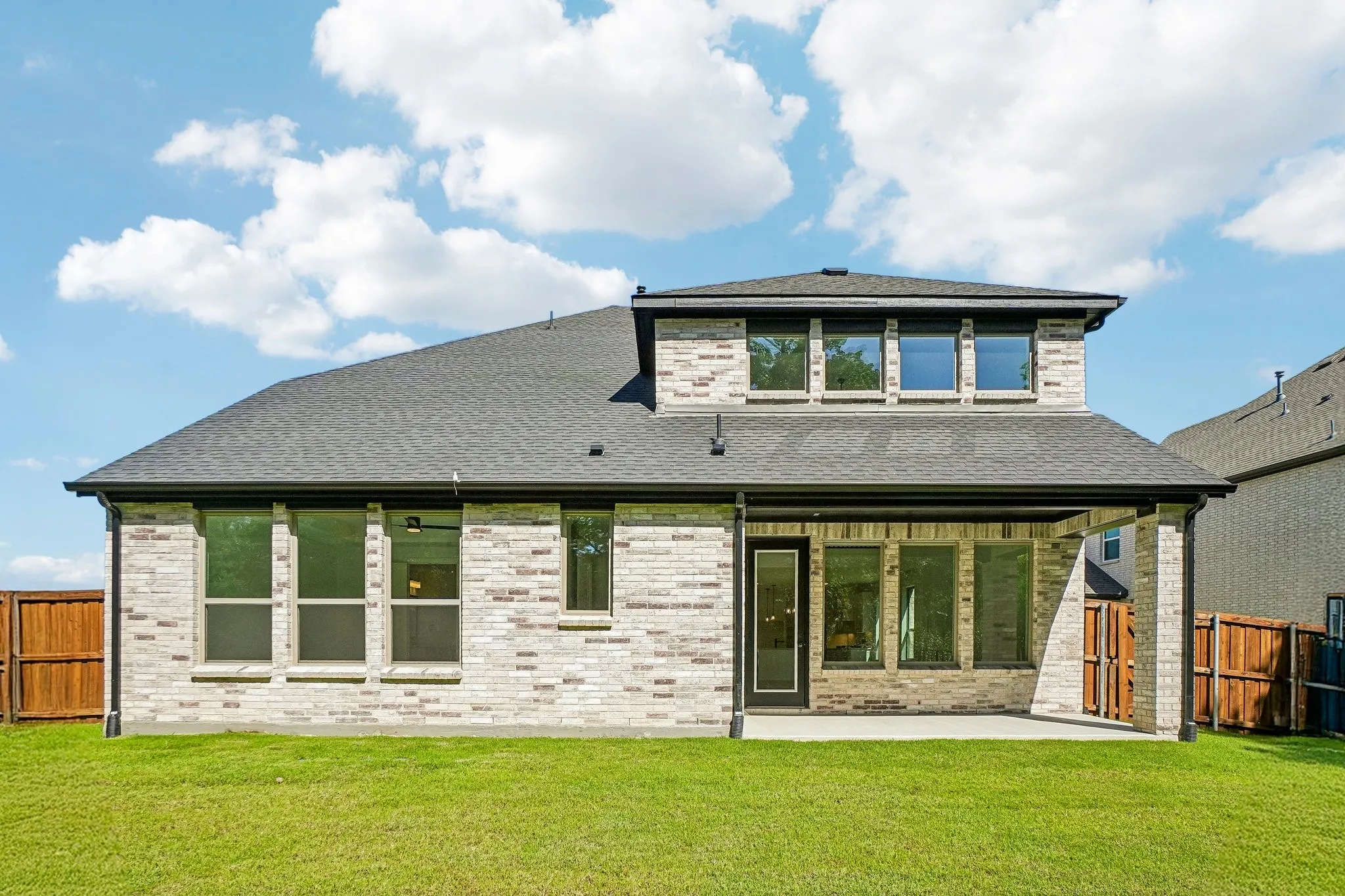 Dining al fresco is in your future on this lovely covered back patio.