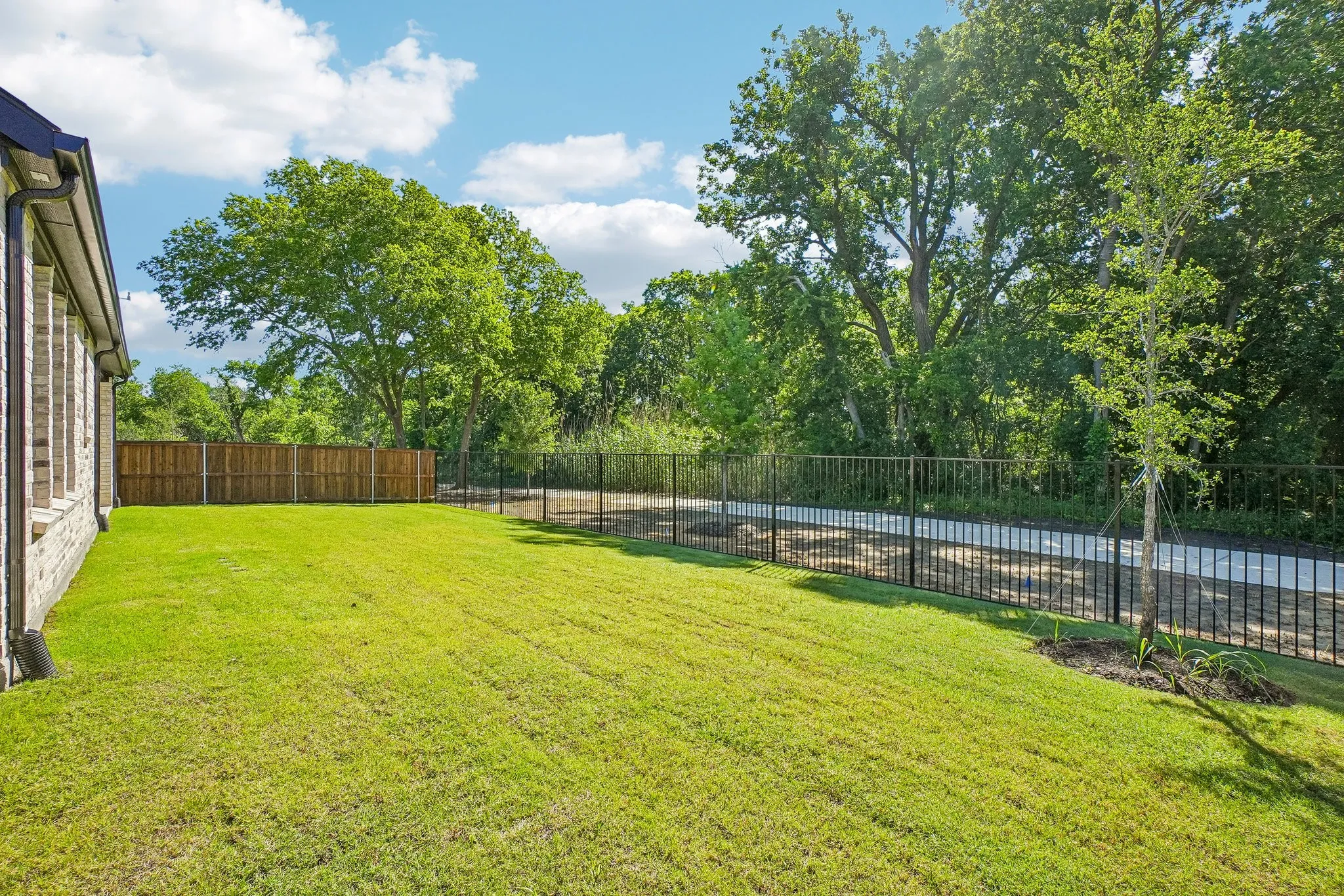 Featuring a fenced yard backing to a lush greenbelt, you'll enjoy beautiful views from this dream home!