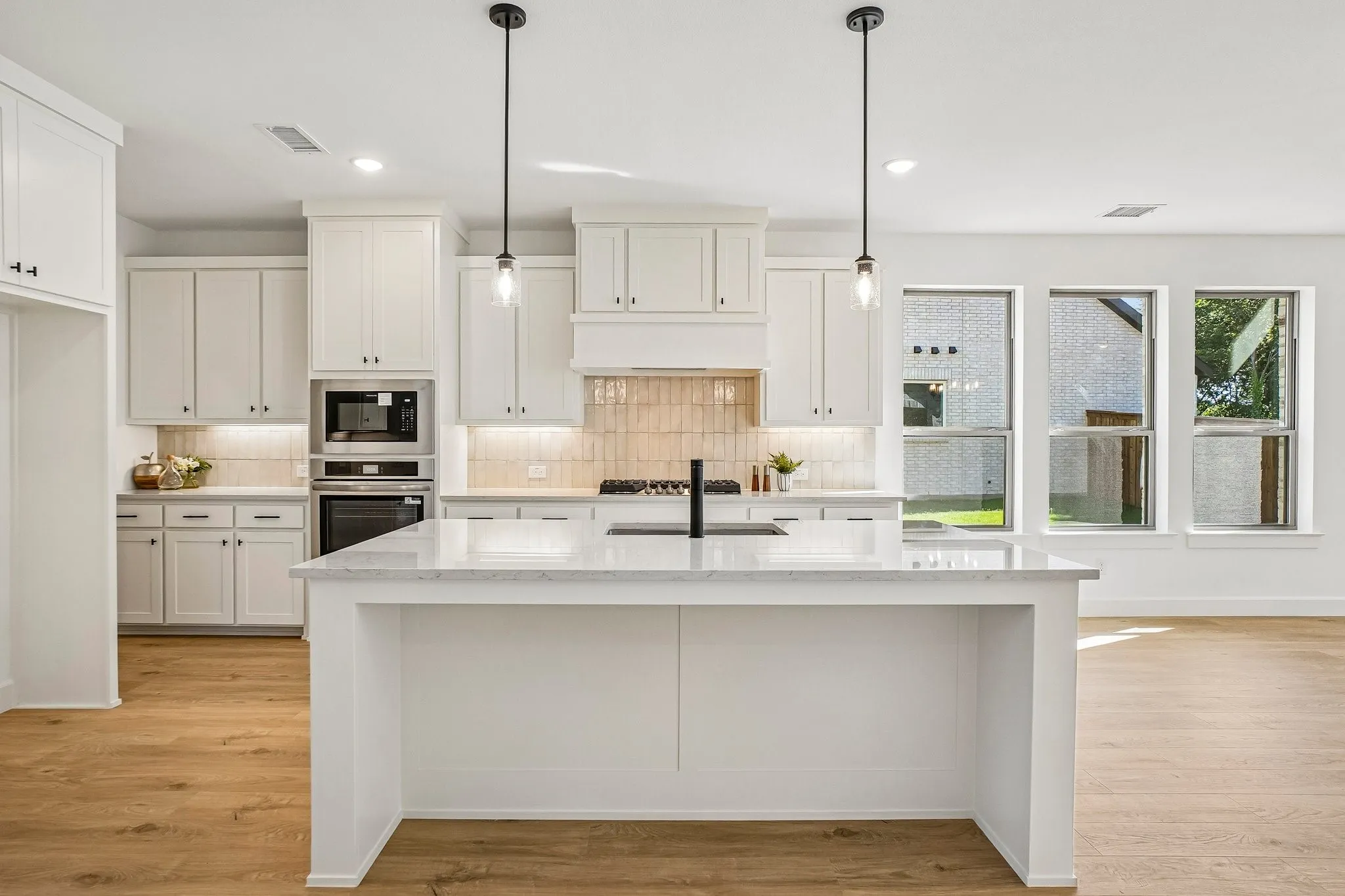 The spacious kitchen island is the hub of your new chefs kitchen and the perfect place for friends and family to gather round!