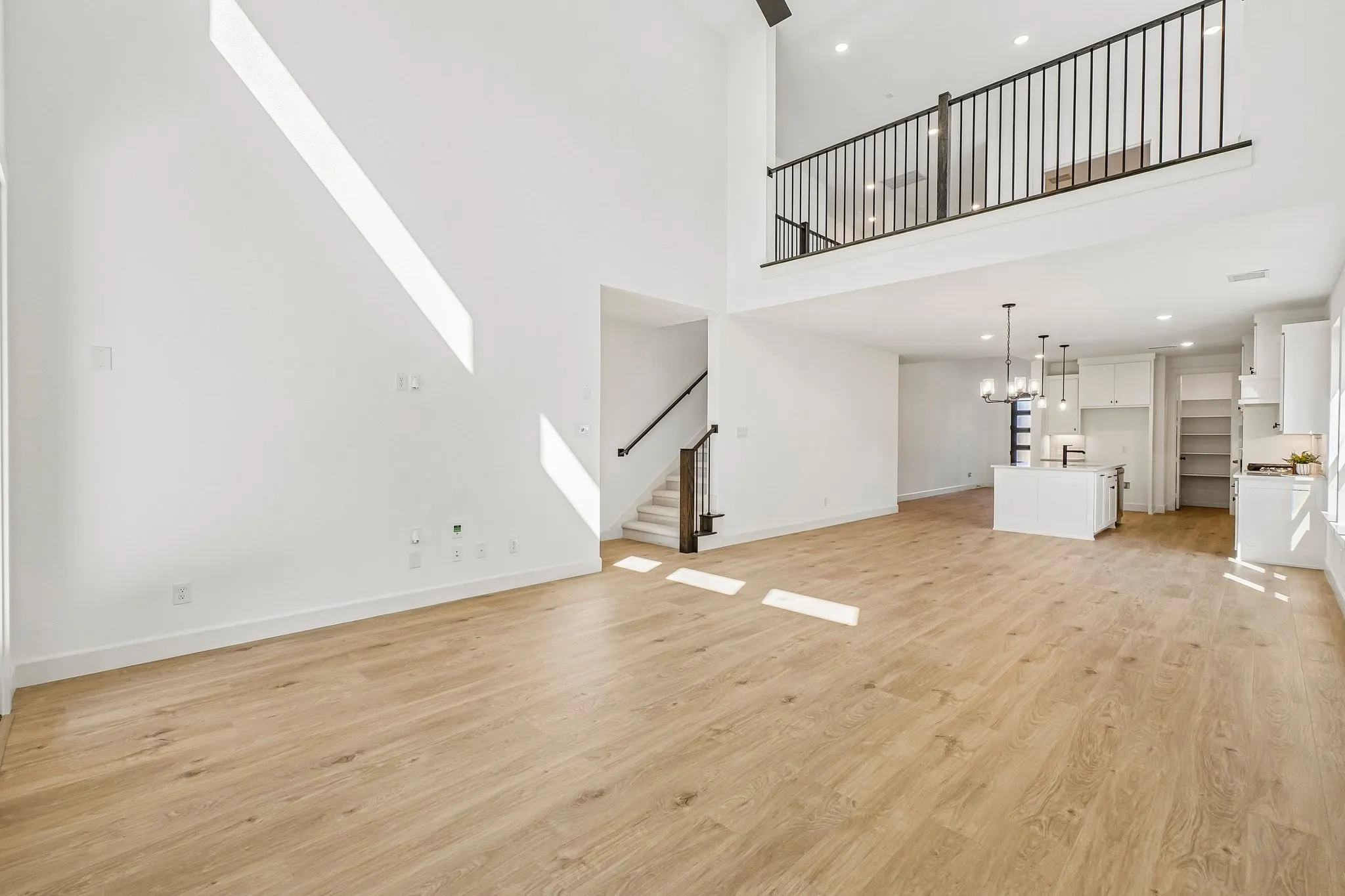 With the game room open to the family room below, this dream home offers a multi-level entertainment area.