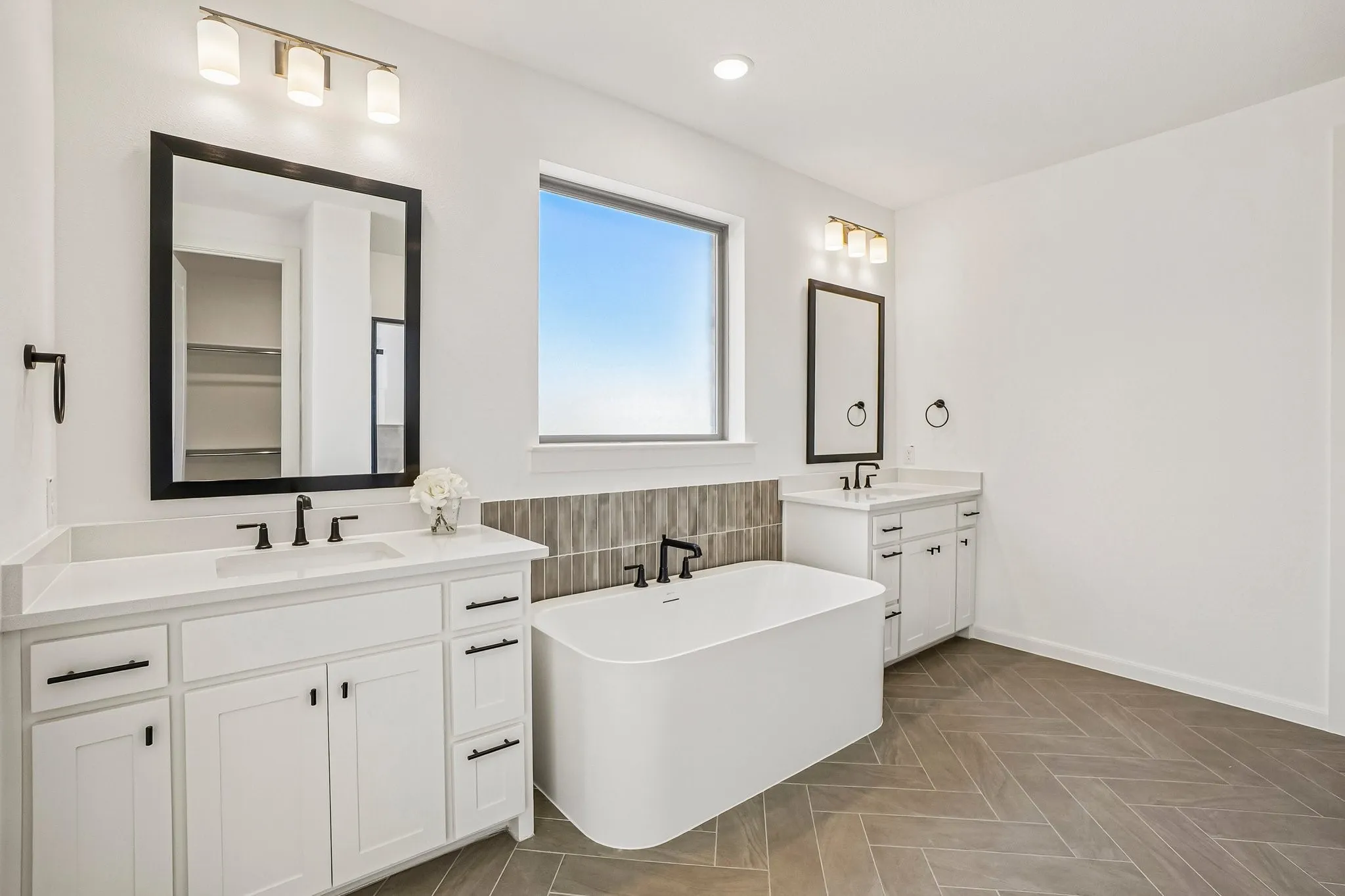 You'll enjoy ample room for two in this beautiful owner's bath!