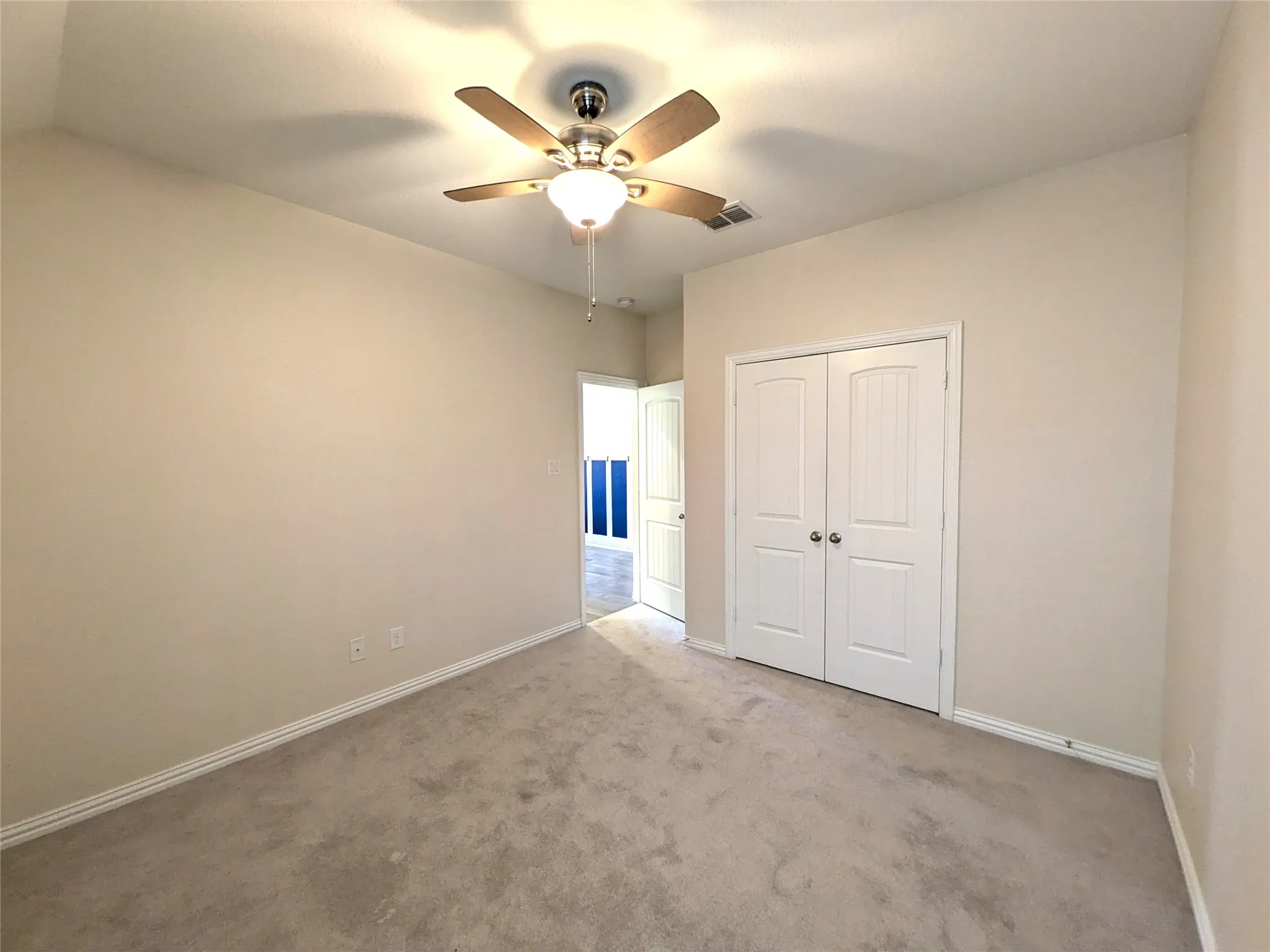 Neutral-toned carpeting paired with light wall paint
