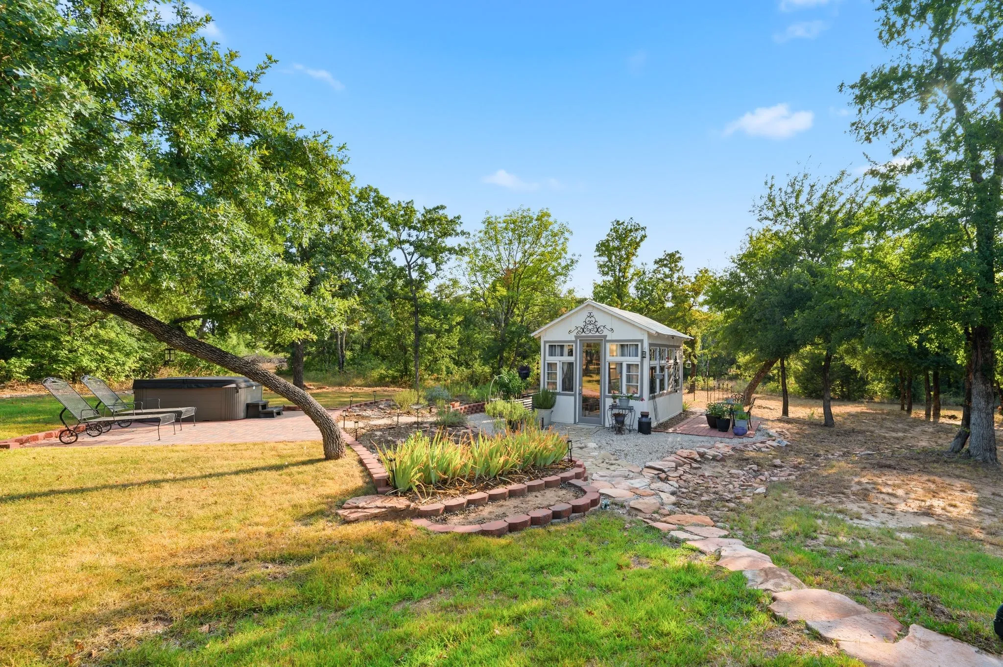 Therapeutic hot tub, raised garden, greenhouse and additional patio areas
