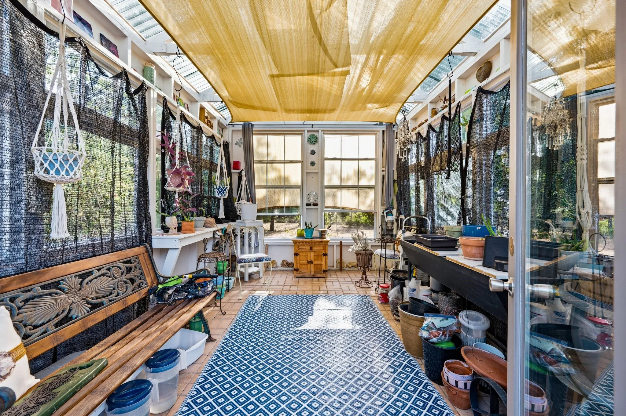 inside of greenhouse, used reclaimed windows + doors
