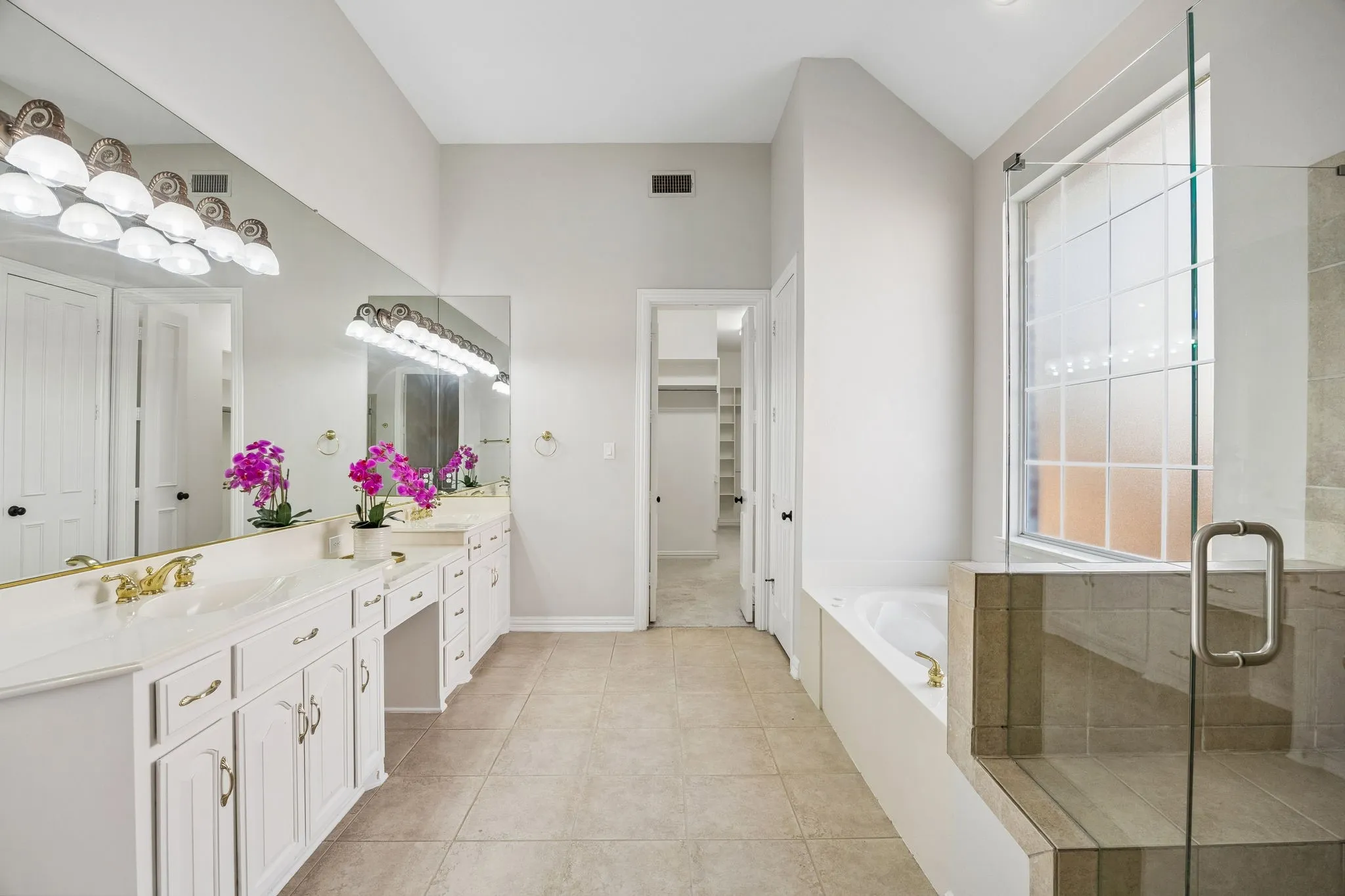 Separate Vanities, Garden Tub, Separate Shower, and Large Walk-In Closet