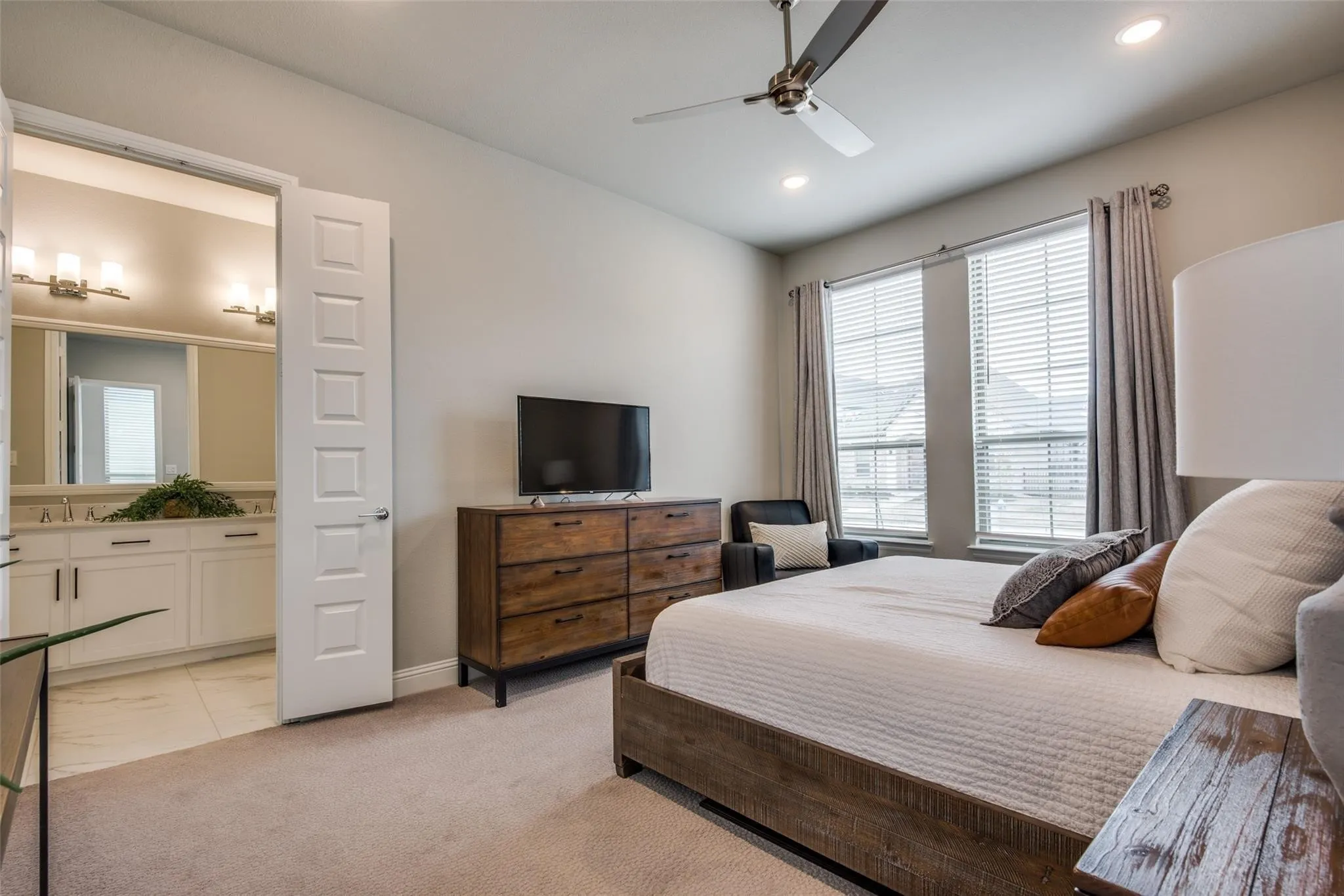 Carpeted room with recessed lighting and a ceiling fan