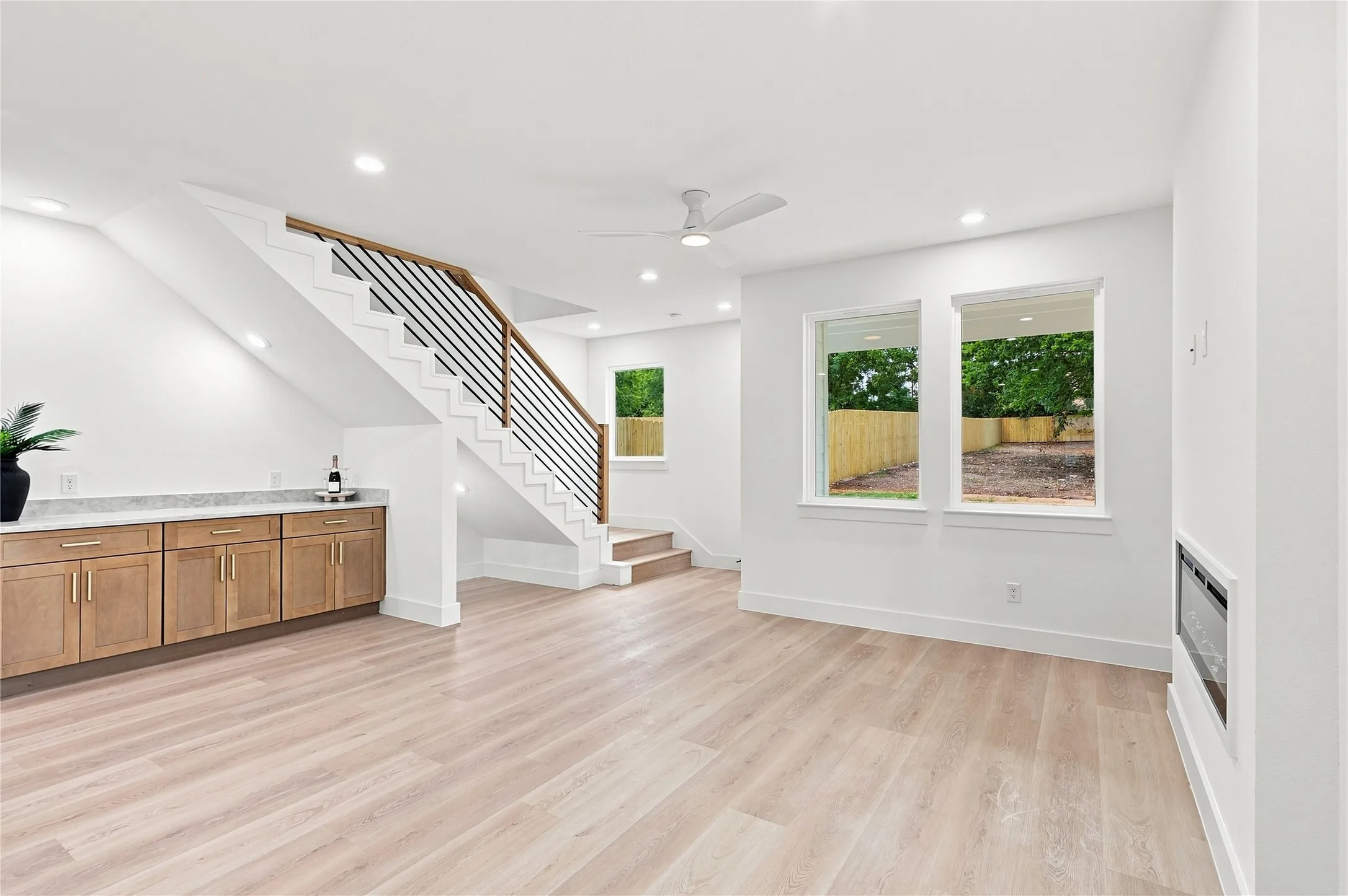 Unit B - Living Room | Open Staircase, under Stairs Doggie-Den and Built-In Dry Bar/ Workspace