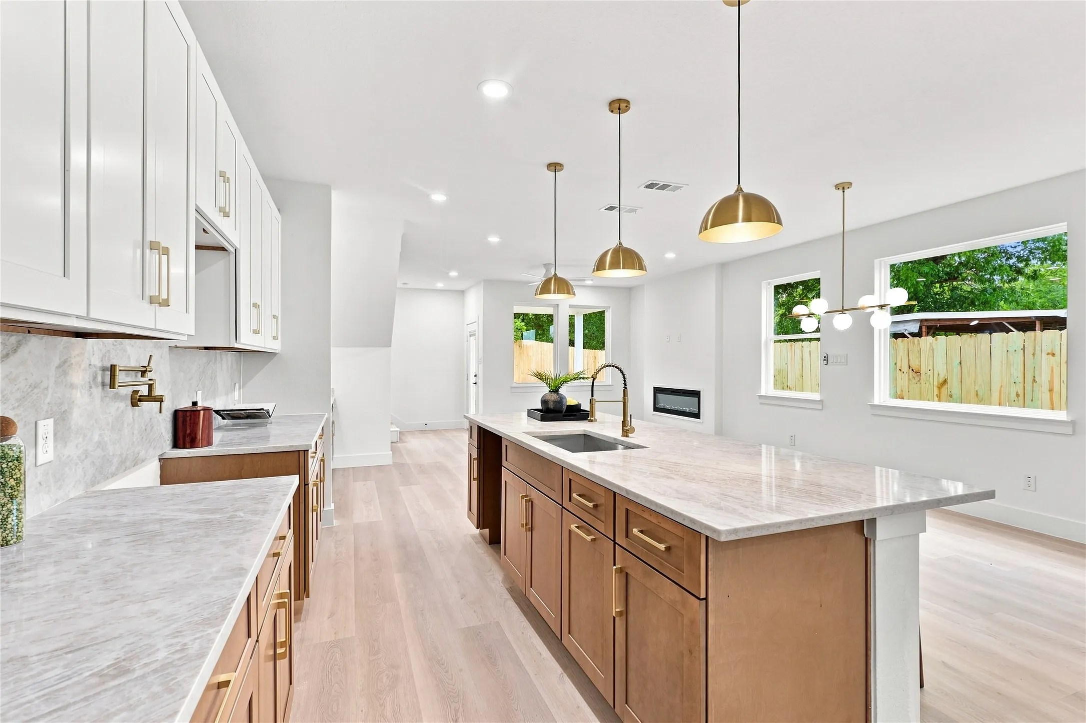 Unit B Kitchen - Quartz Counters, Slab Backsplash and Gold Hardware