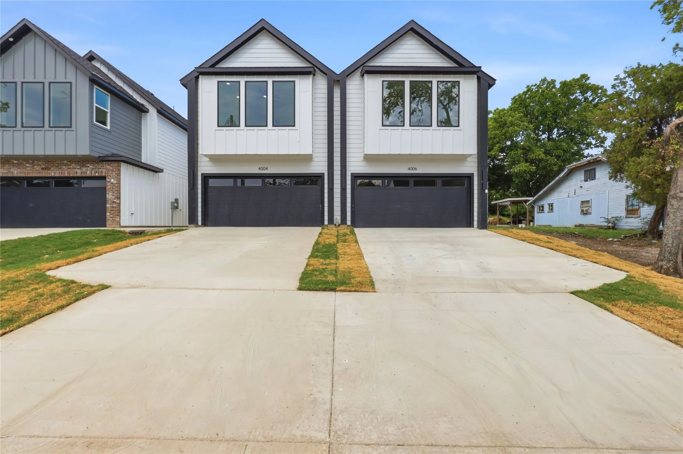 Exterior View of Complete Duplex  From Street Prior to Back Fence and Gate Installation