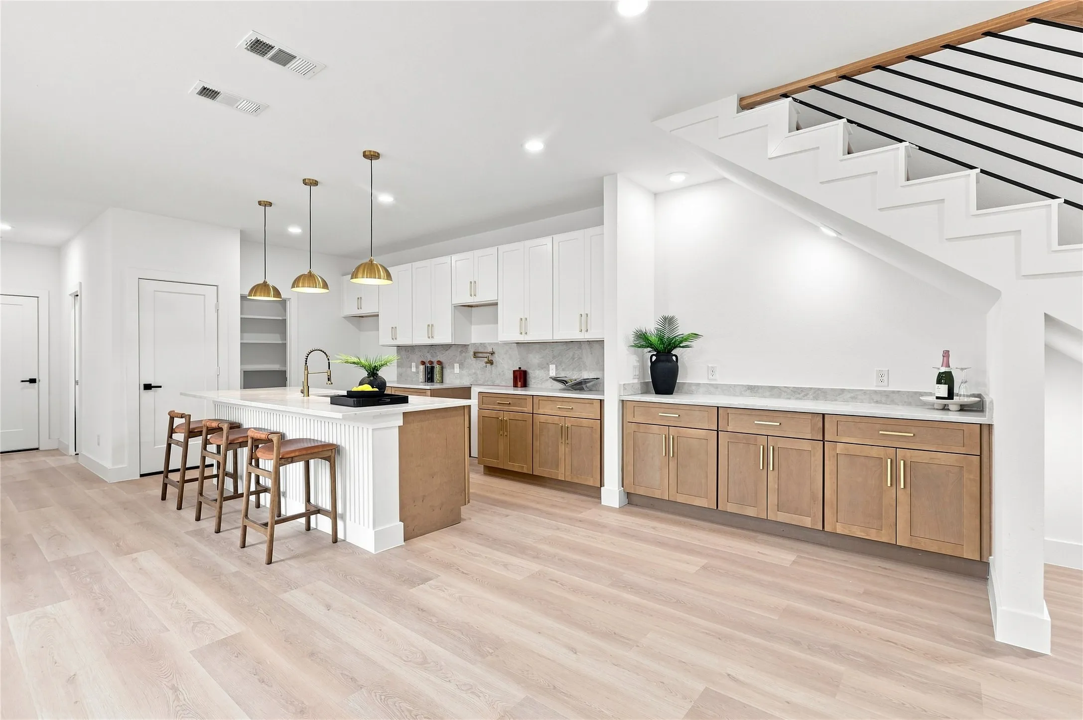 Unit B- Living Room | Open Staircase and Built-In Dry Bar/ Workspace