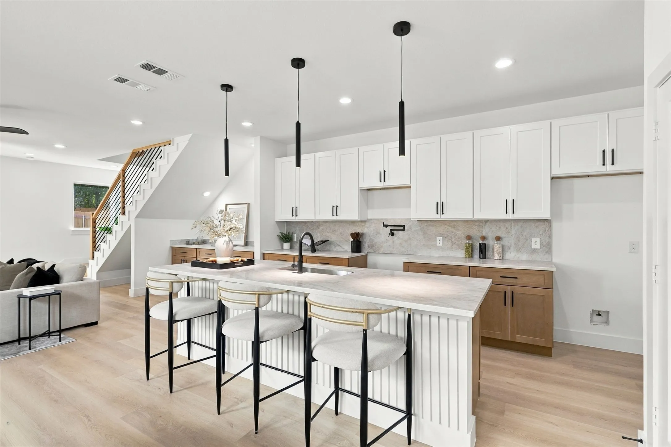 Unit A Kitchen - Waterfall Island, Black Pendants and Two-Tone Cabinetry