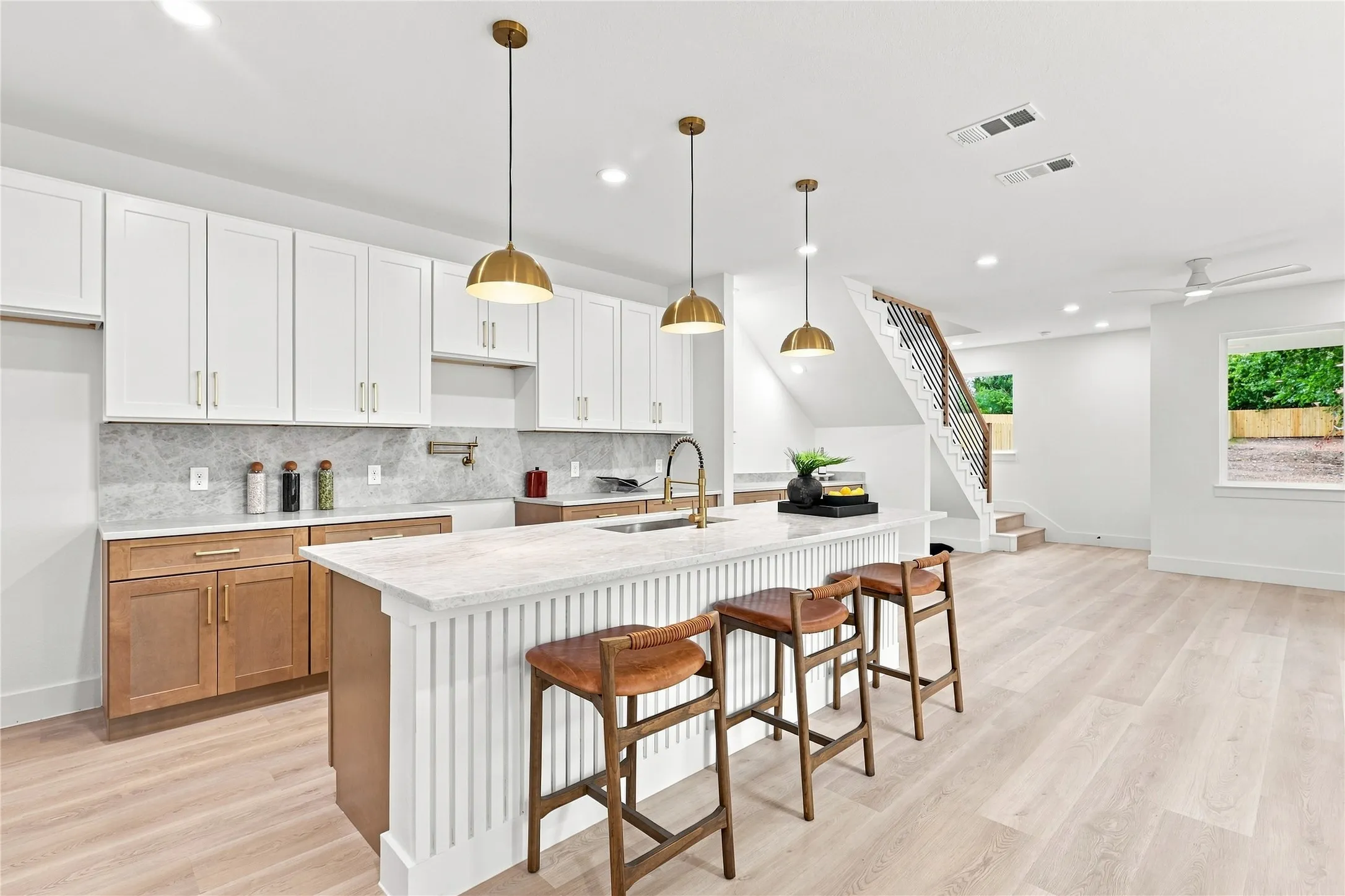 Unit B Kitchen - Waterfall Island, Gold Pendants and Two-Tone Cabinetry