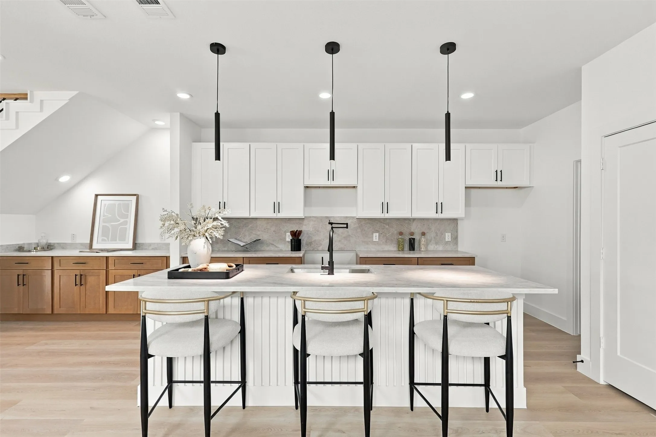 Unit A Kitchen - Centered Island View with Black Pendants