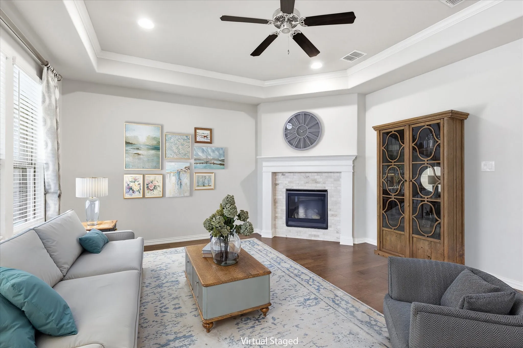 Virtual Staging Recessed lighting and a ceiling fan illuminate the room