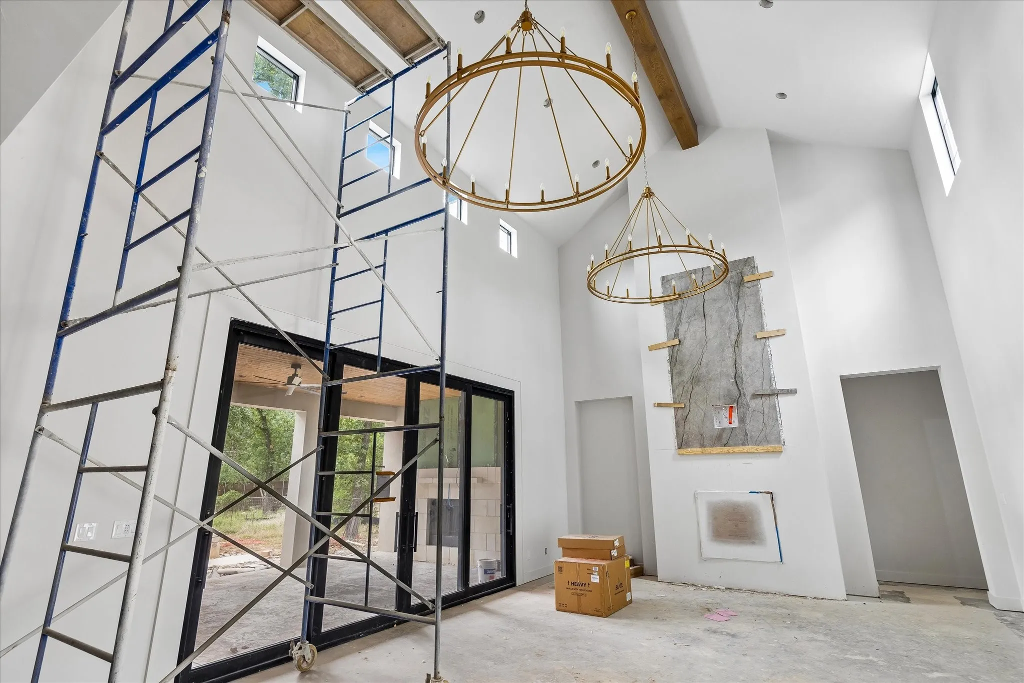 Soaring 2-Story Ceilings in the Great Room with folding glass doors to patio