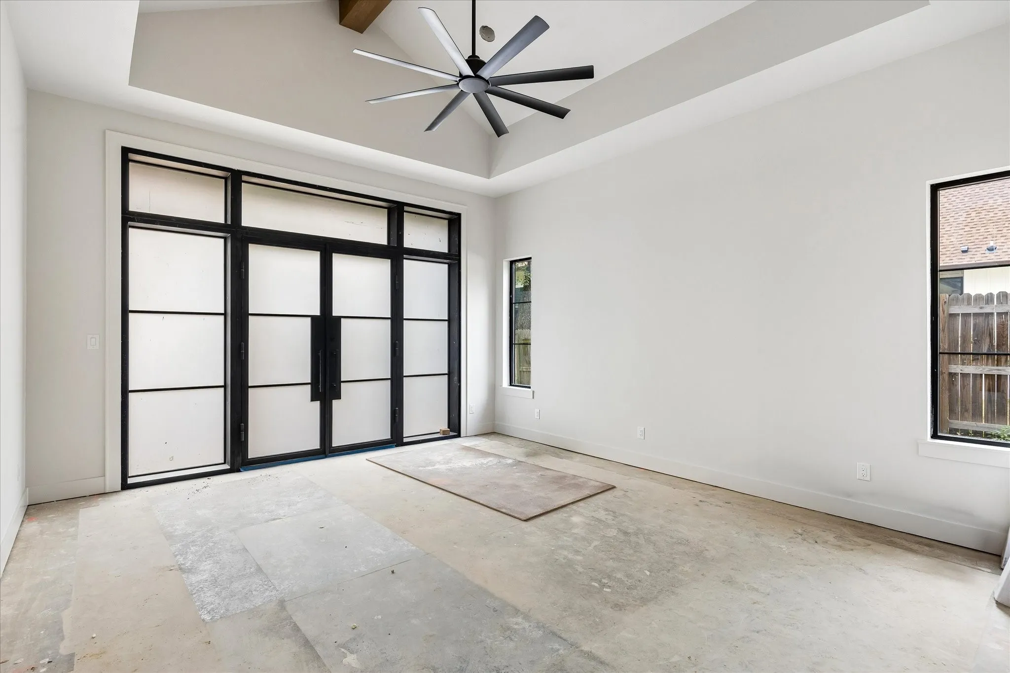 Primary Bedroom with Cathedral Ceiling, and Doors to Backyard