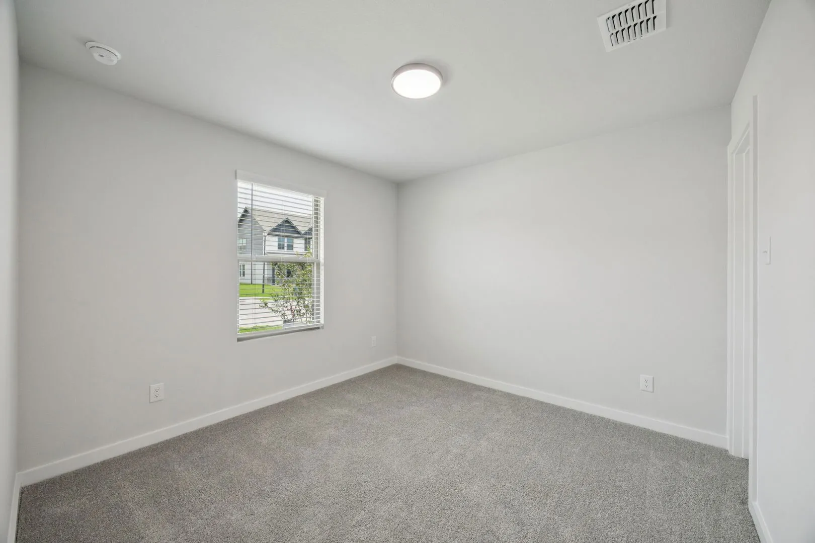 Bedroom in the Hadley home plan by Trophy Signature Homes – REPRESENTATIVE PHOTO