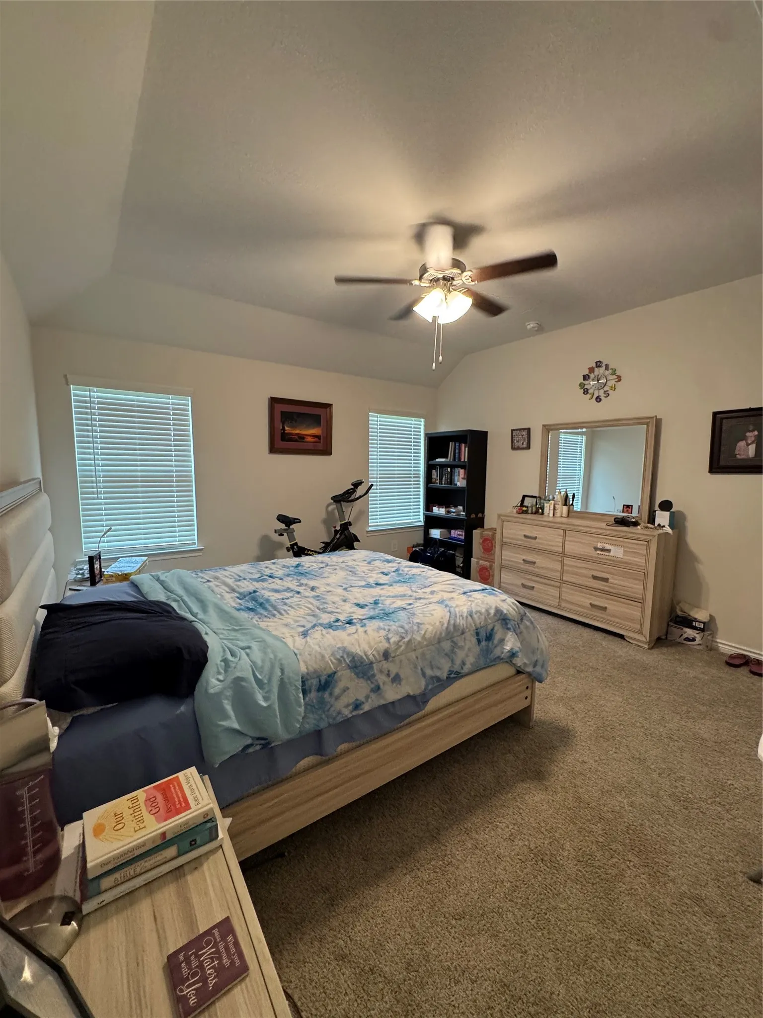 Bedroom featuring carpet flooring, multiple windows, and ceiling fan