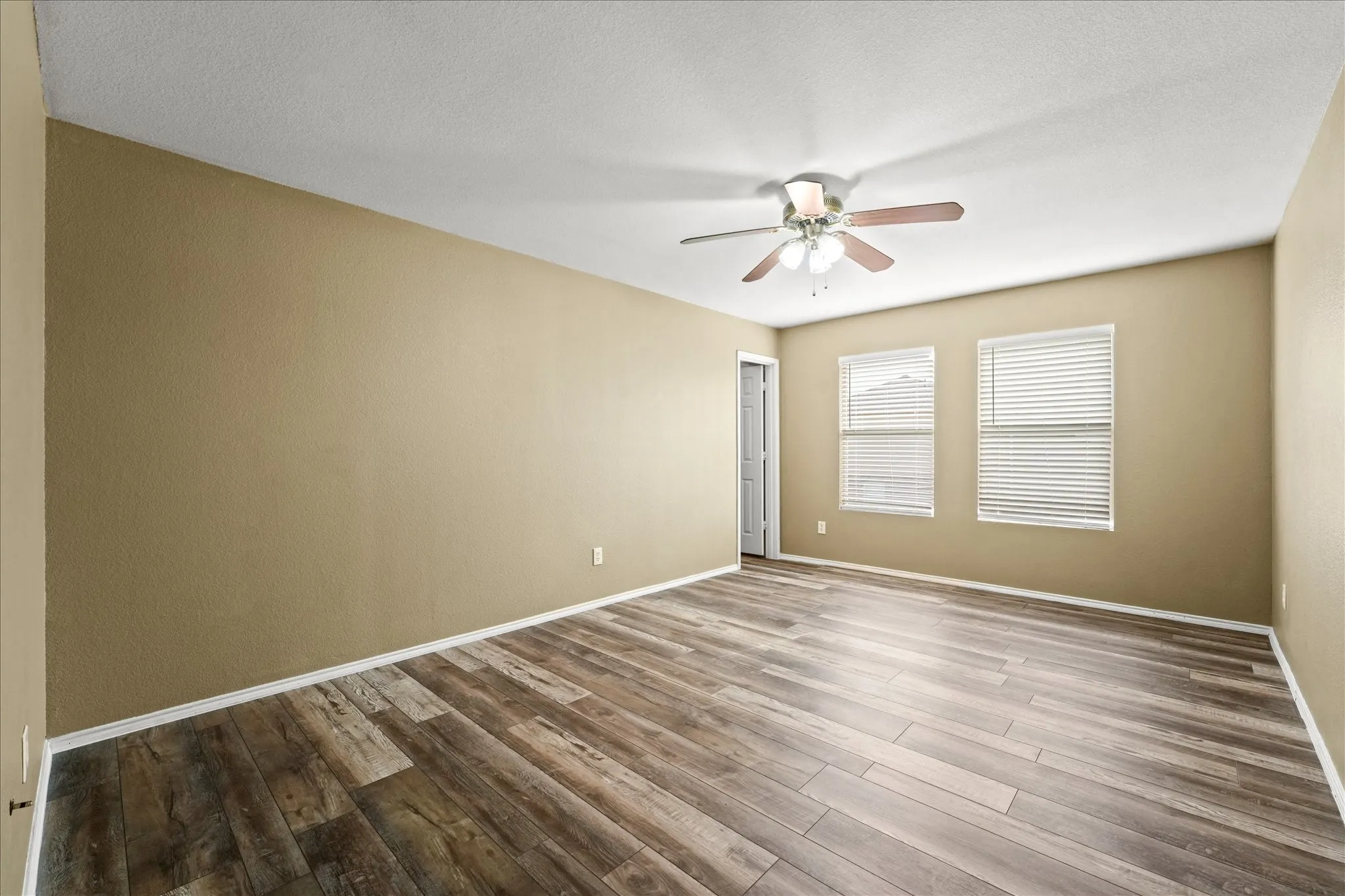 Spare room featuring ceiling fan and wood finished floors