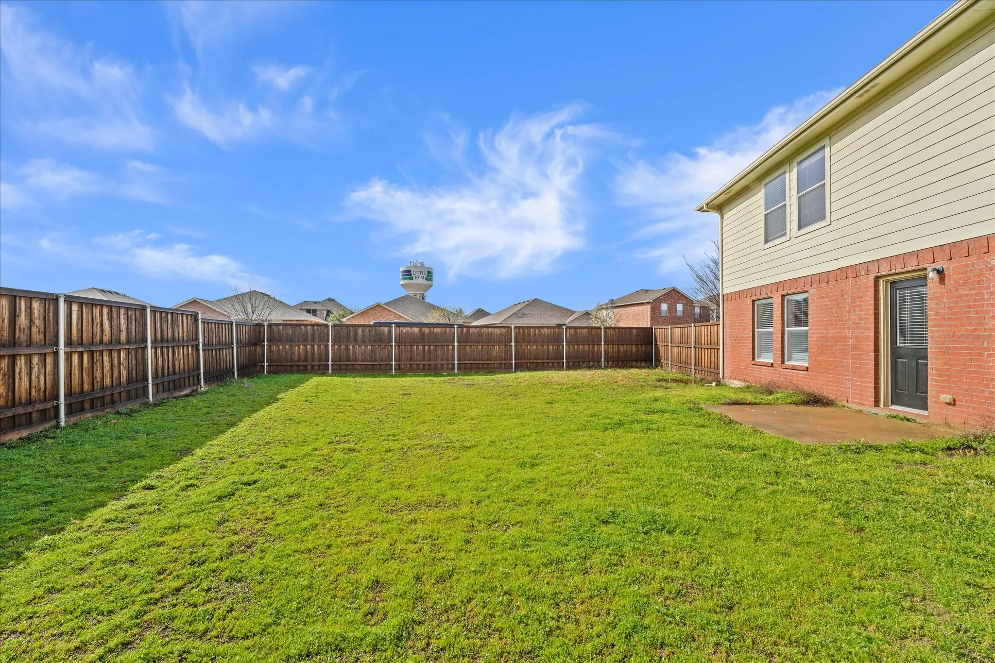 View of fenced backyard