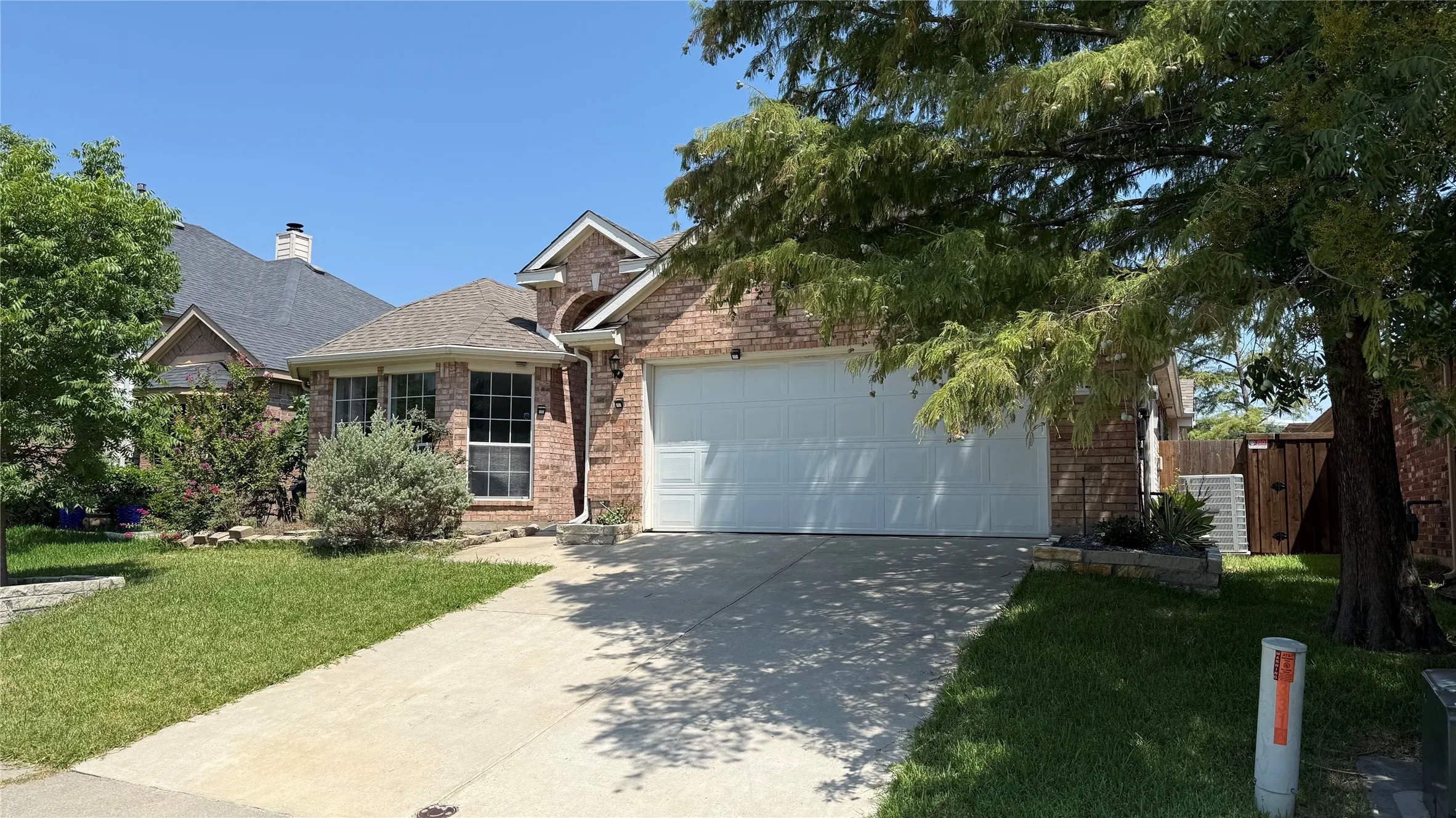Traditional brick facade with an attached two-car garage